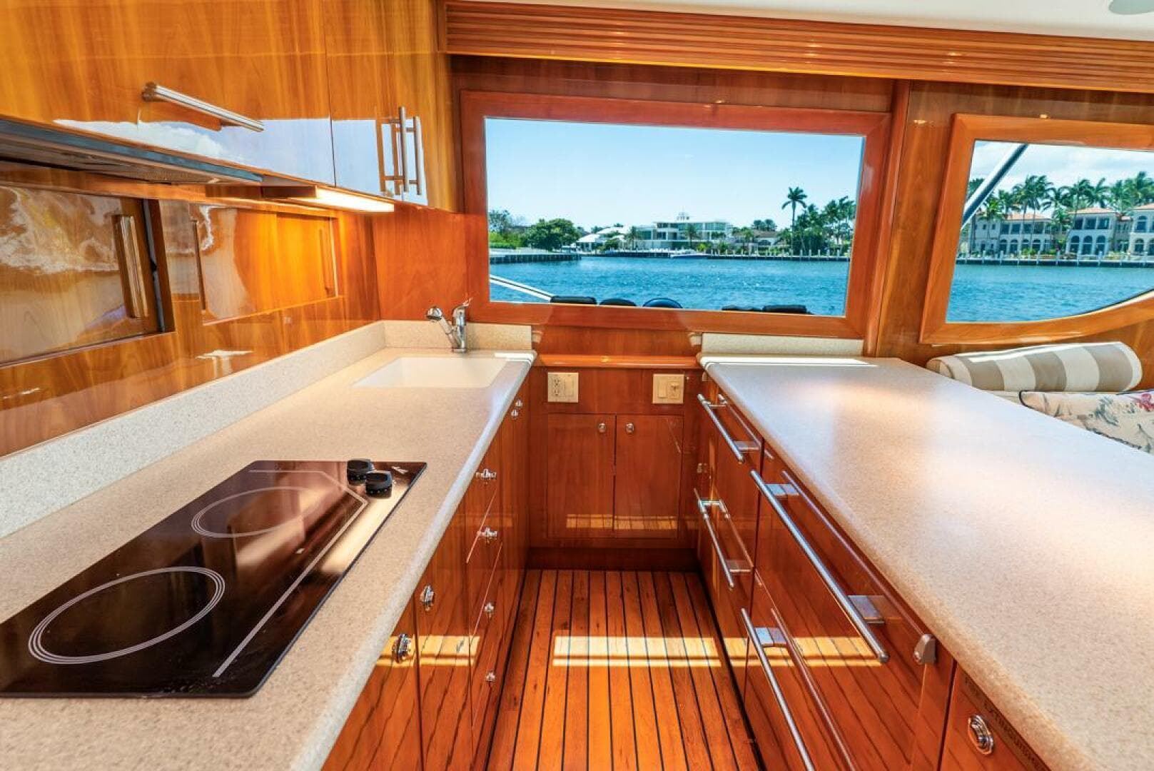 Luxurious kitchen interior of 2005 Hatteras 50 Convertible Sportfish yacht with waterfront view.
