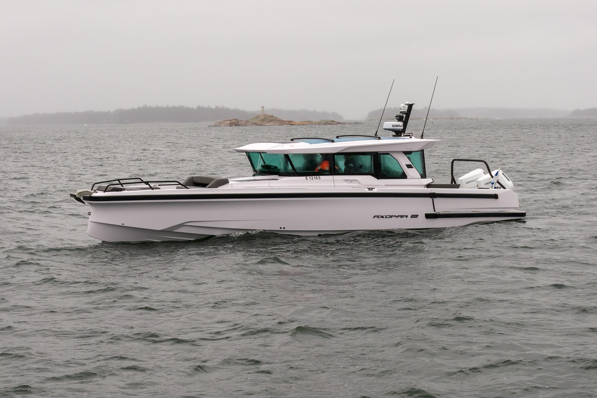 2027 Axopar 38 Cross Cabin boat on a cloudy day at sea.