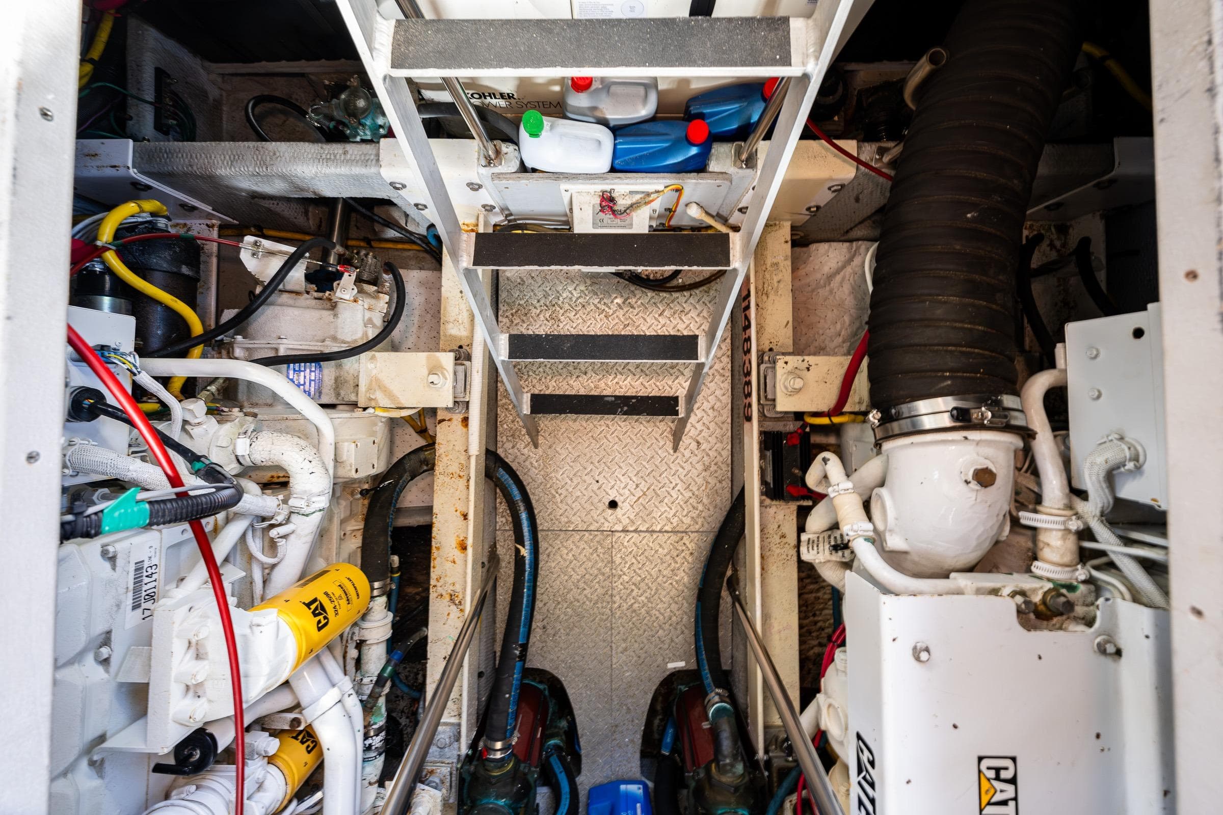 Engine room of 2001 Silverton 410 Sport Bridge with visible machinery and components.