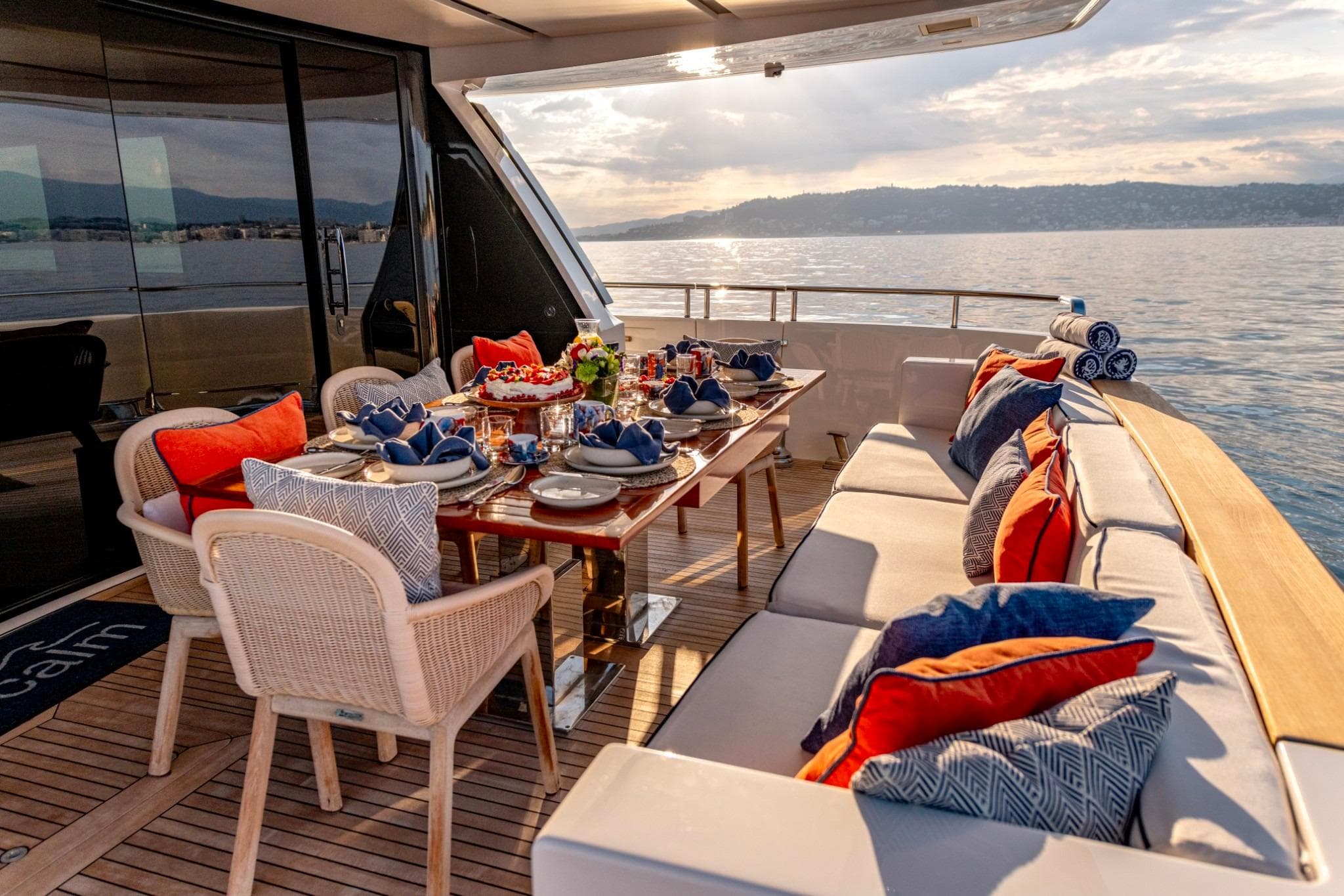 Luxurious 2016 Sanlorenzo SL96 yacht deck with elegant dining setup and scenic ocean view.