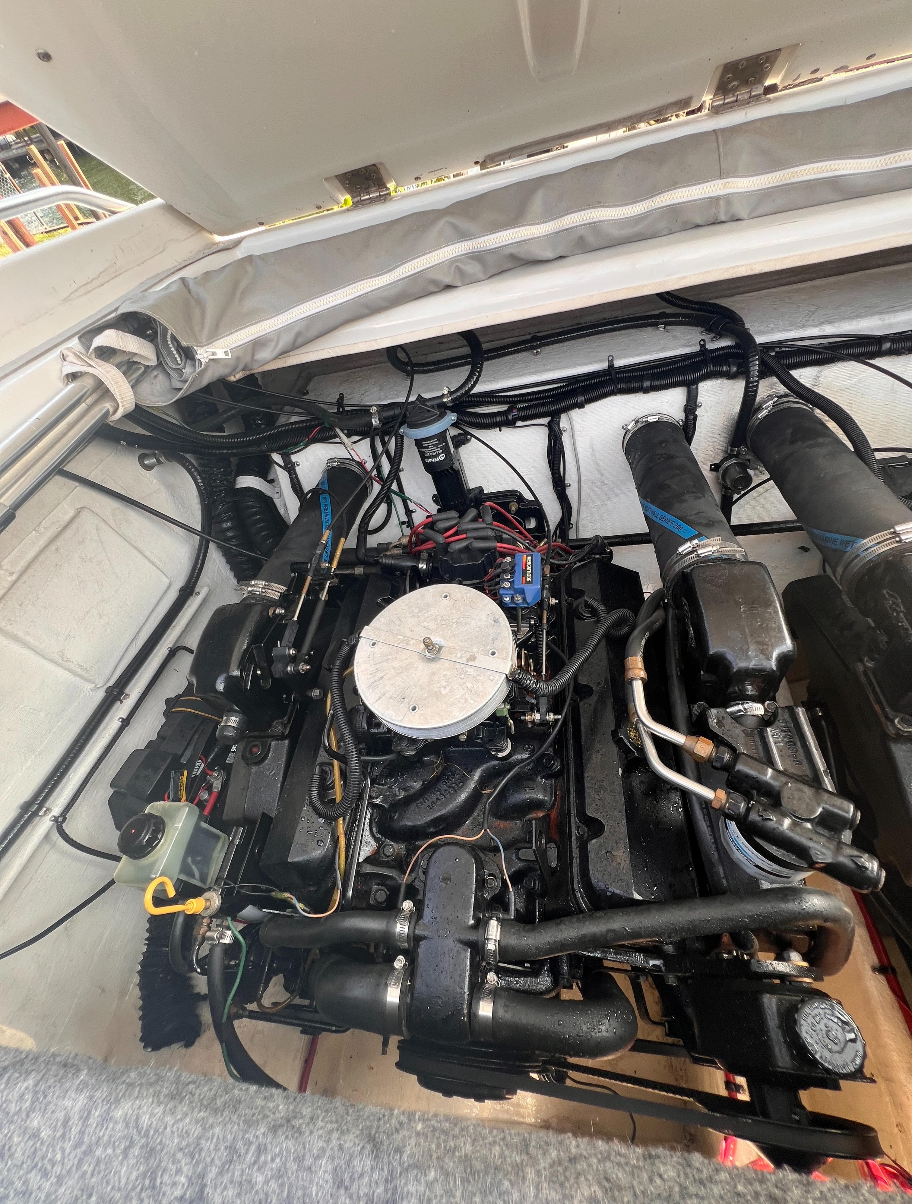 Engine compartment of a 1995 Powerquest 290 Enticer FX boat.