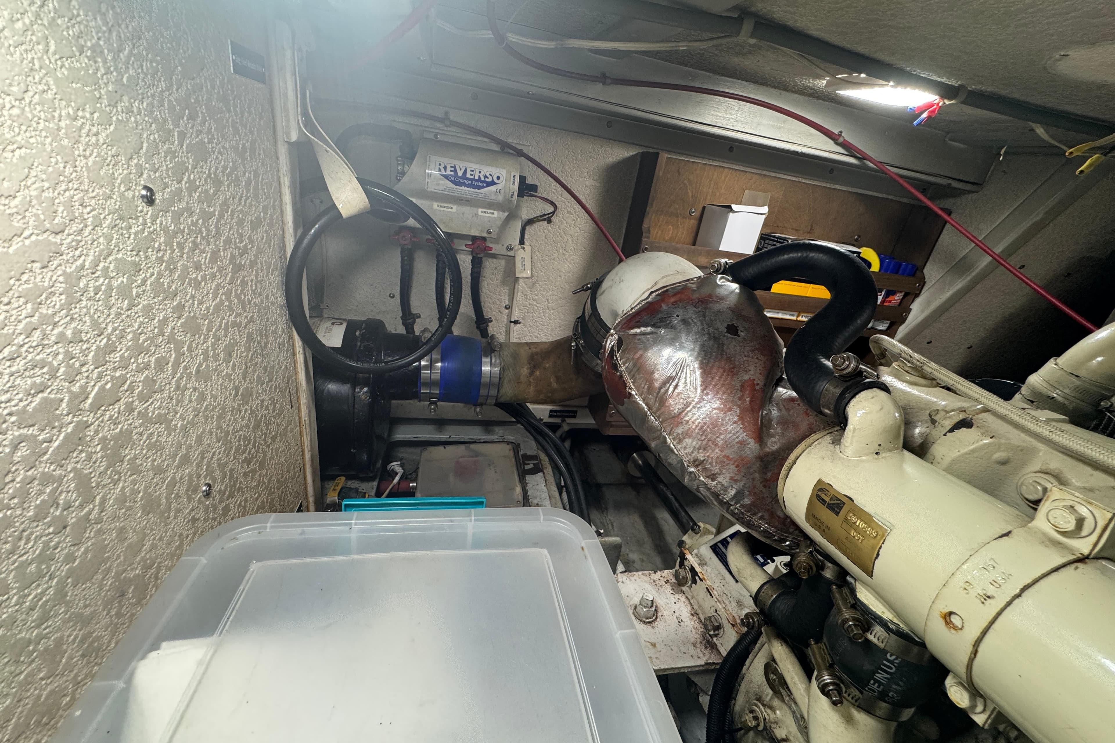 Engine room of a 2001 Monk Trawler with visible mechanical components and wiring.