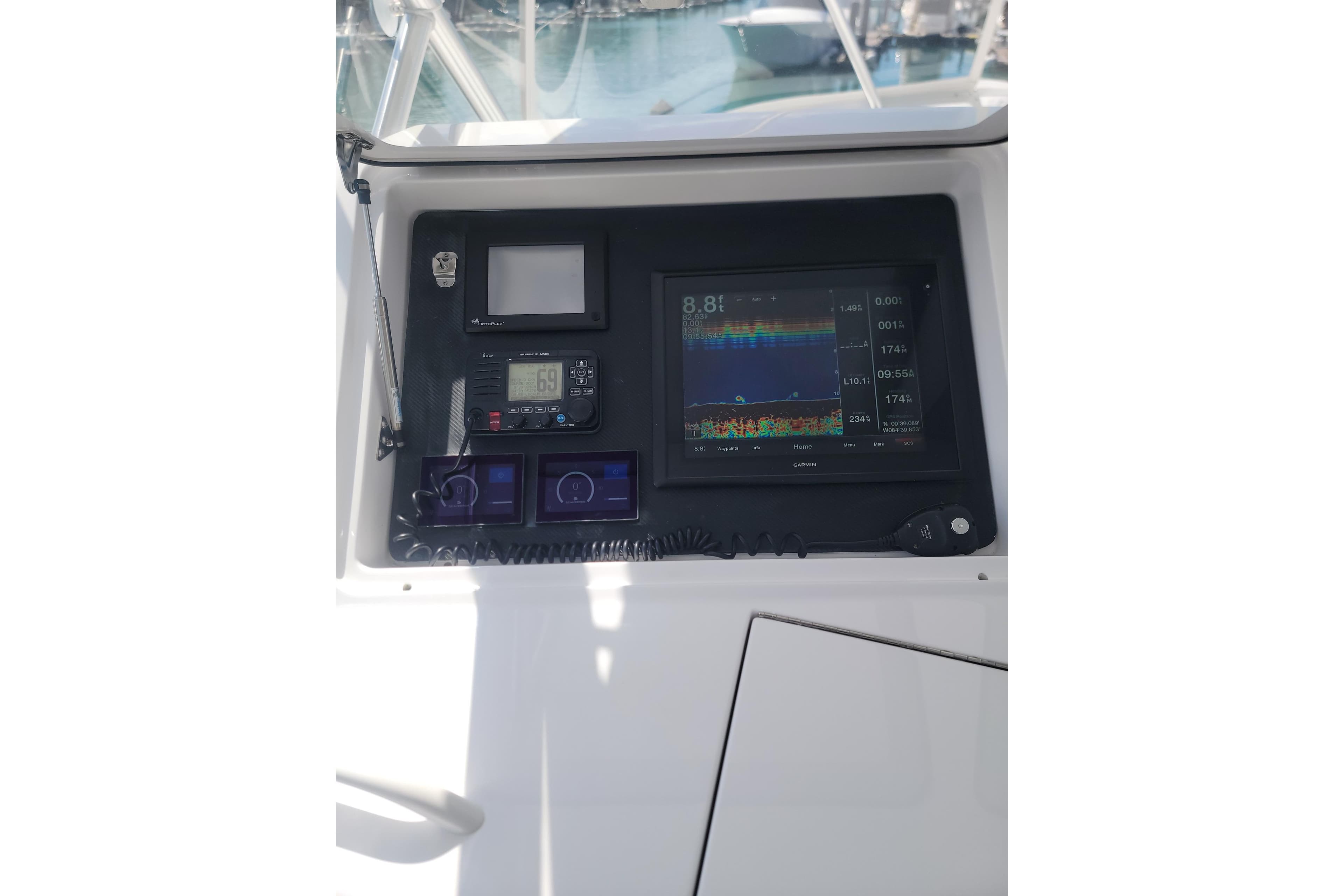 Control panel of a 2012 Viking 64c yacht with navigation and communication equipment.