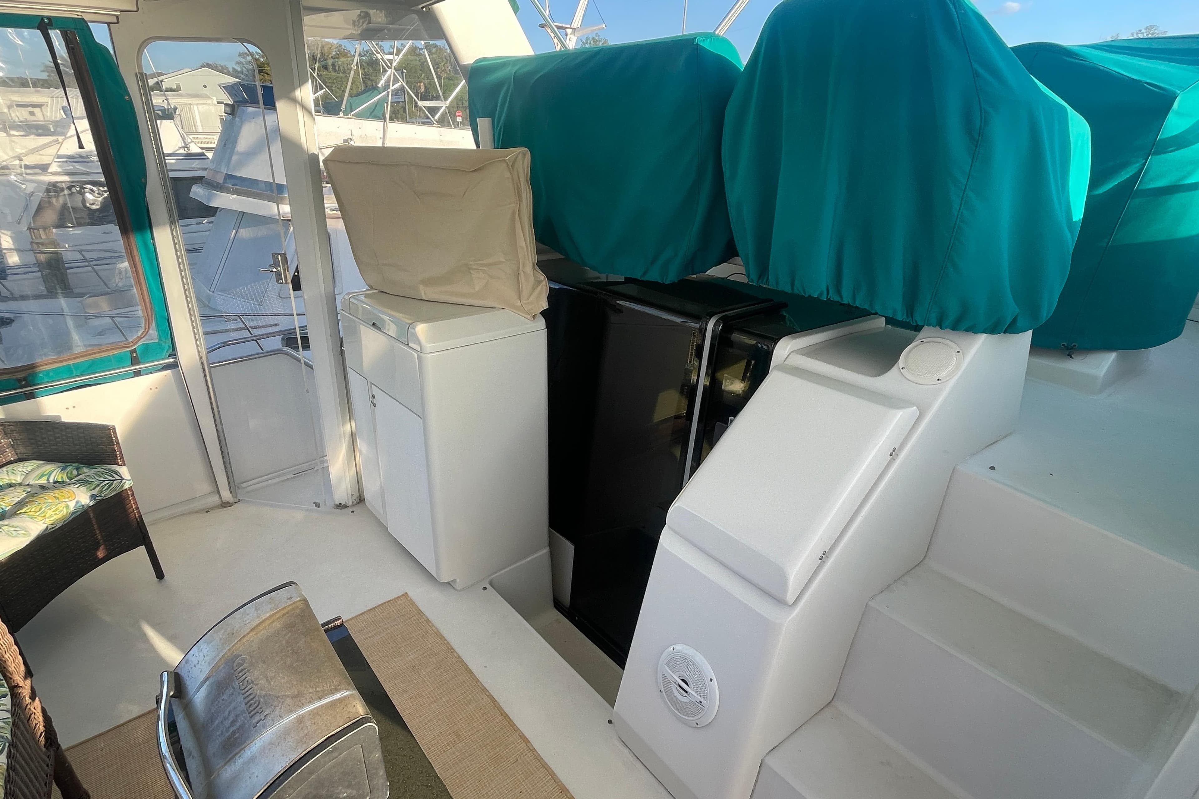 1995 Carver 355 Aft Cabin Motor Yacht interior with covered seating and steps.