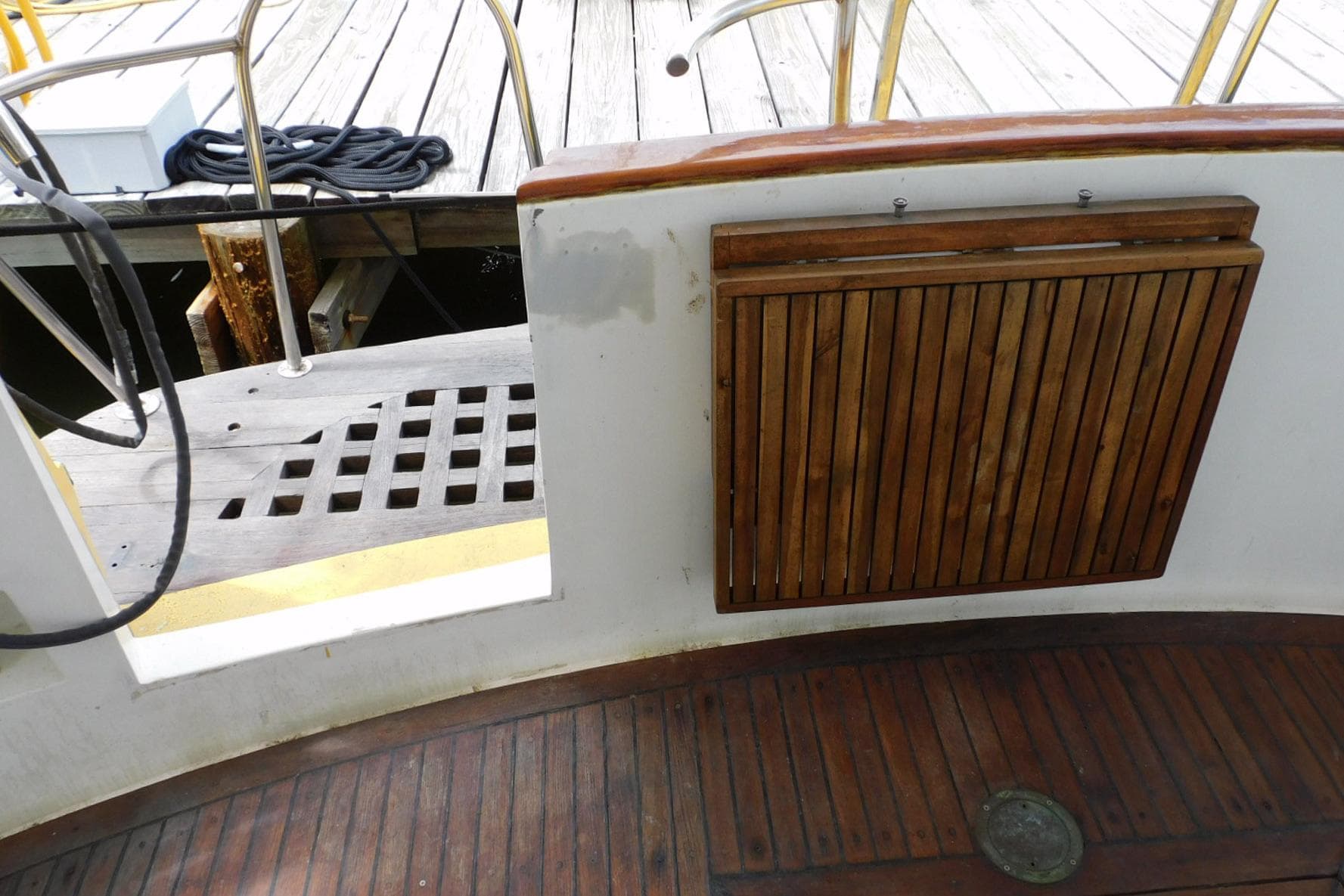 1988 Hans Christian 45 Independence Trawler deck with wooden details and dock view.