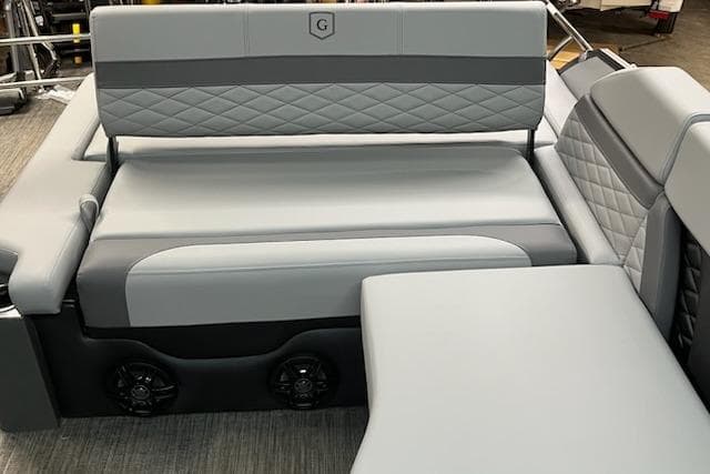 Luxurious 2026 MONACO 235SFL boat seating with gray upholstery and diamond stitching.
