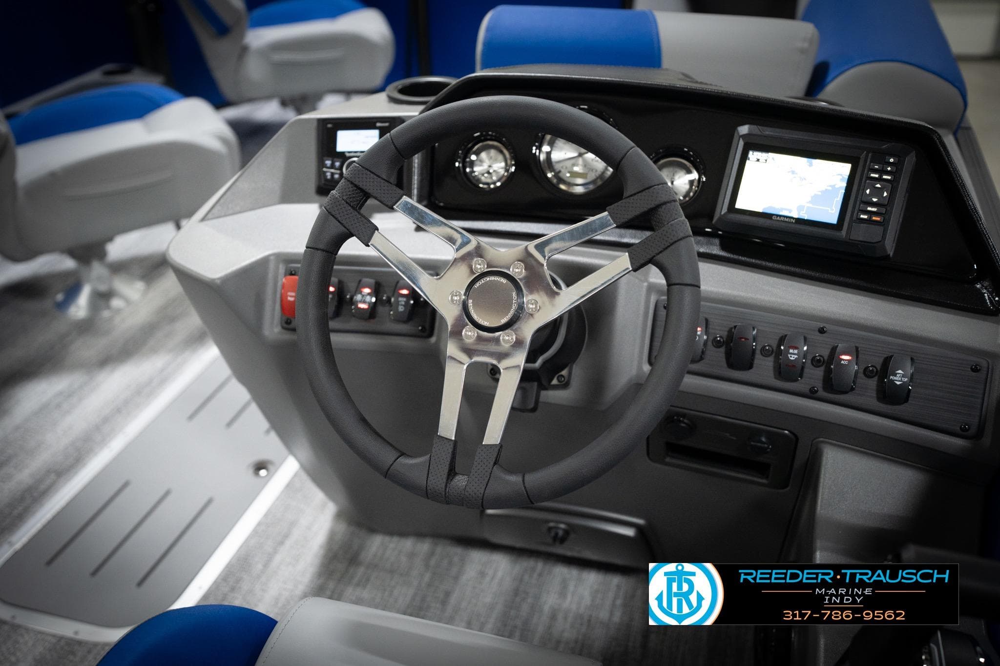 2026 Bennington 22 SSB boat dashboard with steering wheel and navigation system.