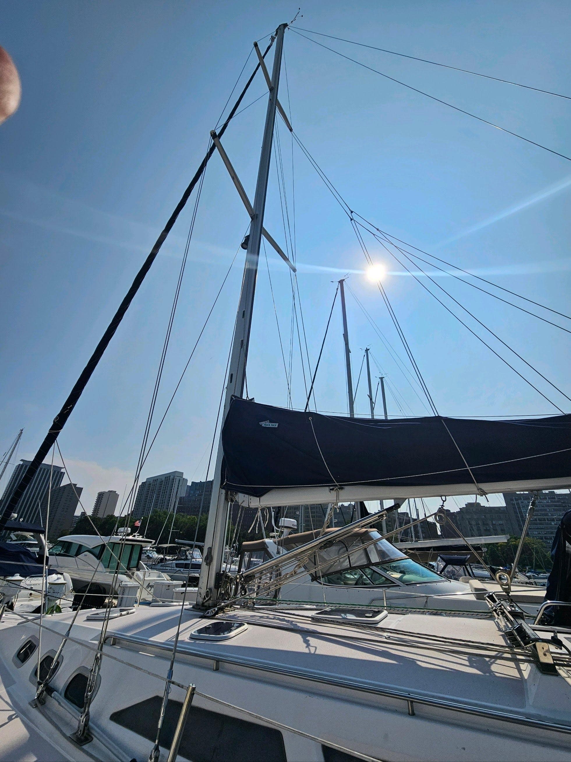 Catalina 380 sailboat from 2000 docked under sunny sky.