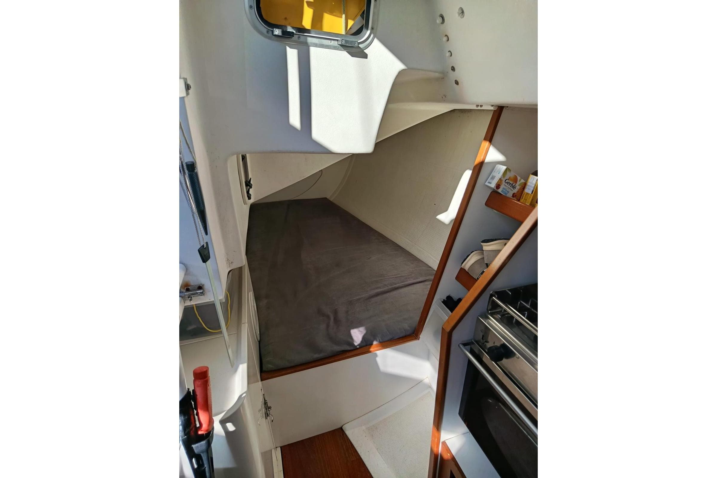 Interior cabin of 2013 J Boats J/111 sailboat with cozy sleeping area.