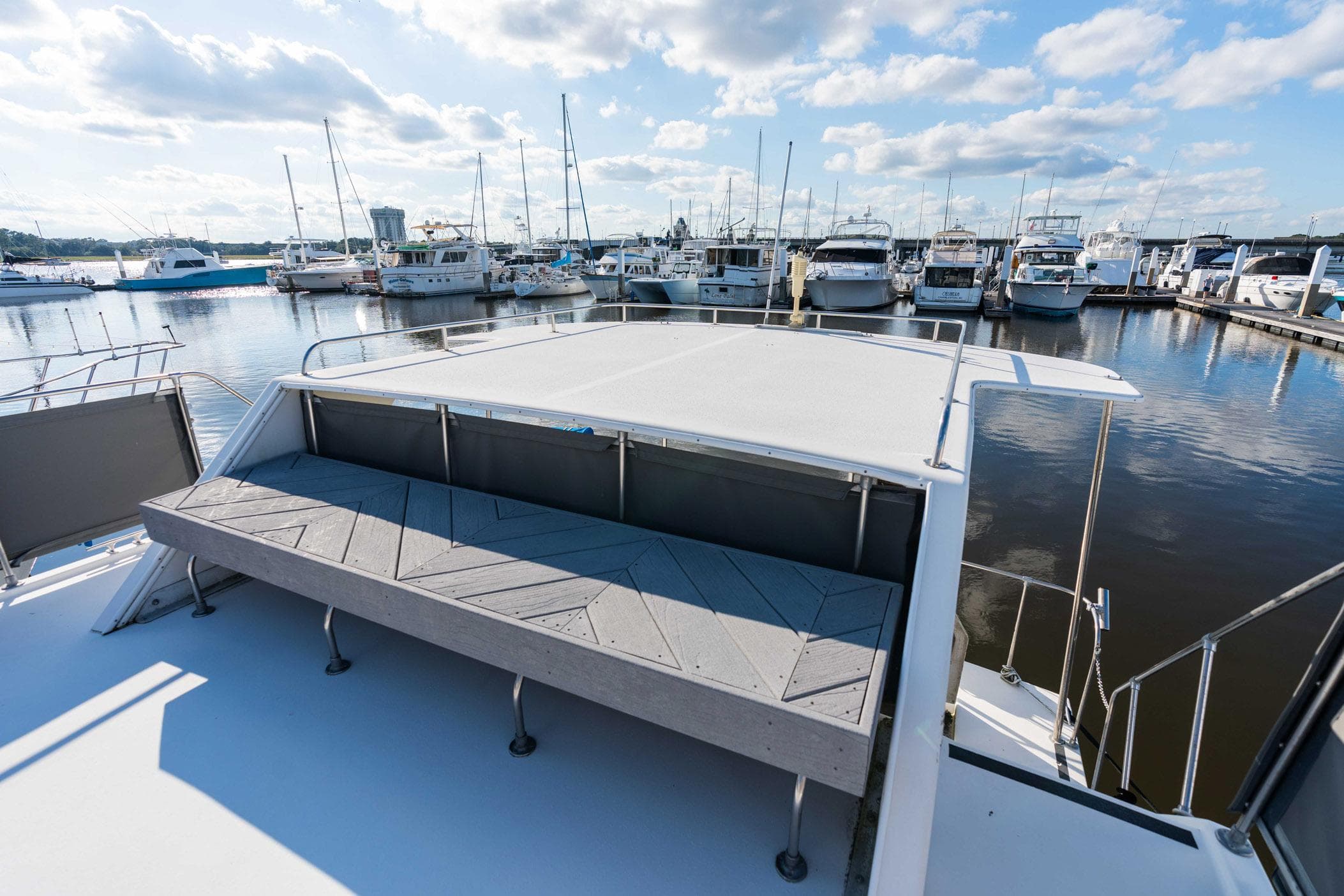 2001 Harbor Master 520 Coastal yacht docked at marina under blue sky.