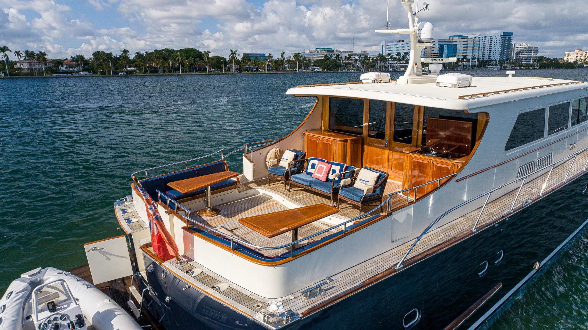Luxurious 2006 Vicem 85 Classic yacht on serene waters, featuring elegant outdoor seating.