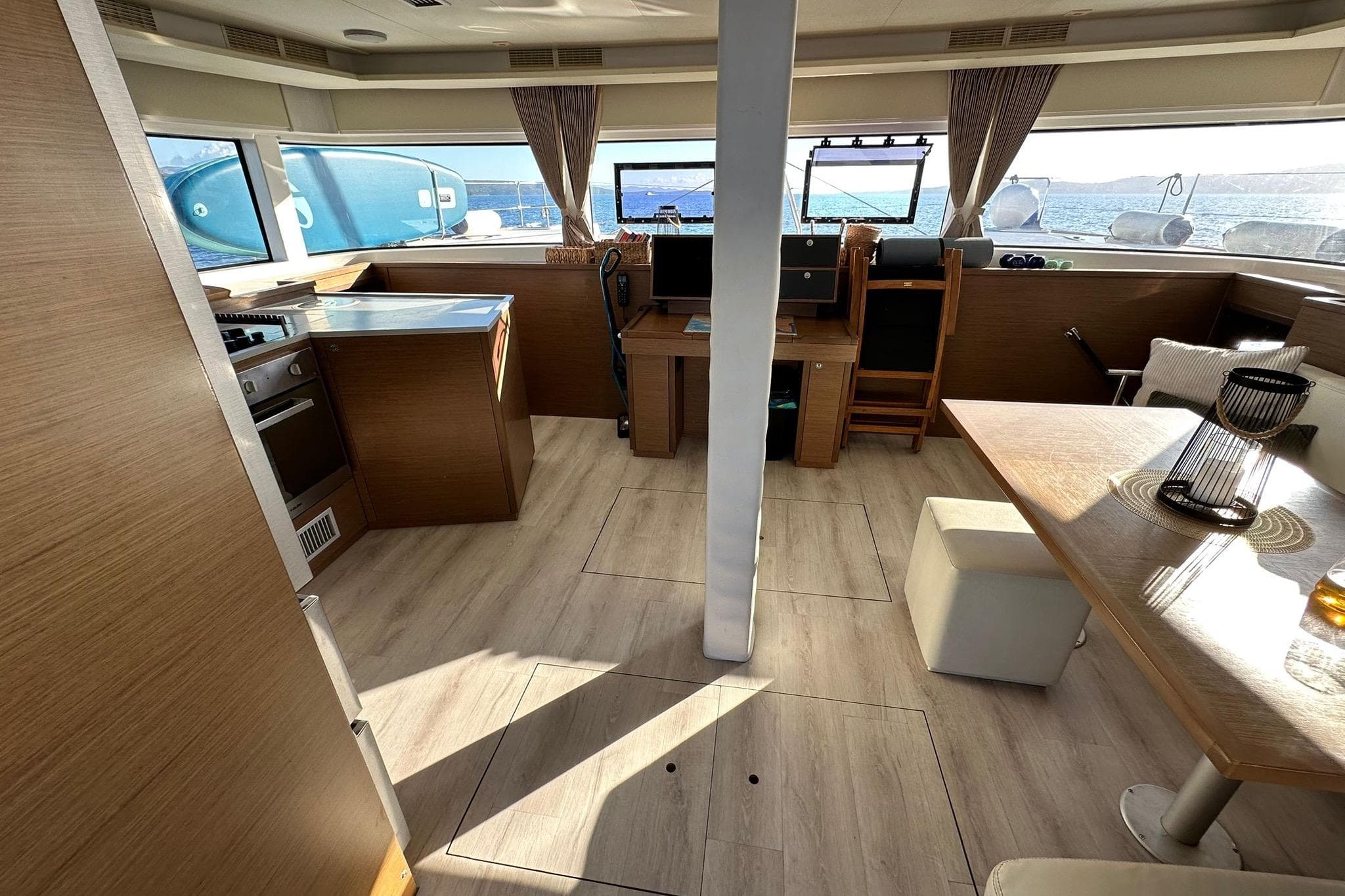 Interior of 2019 Lagoon 52 F yacht with modern kitchen and dining area.
