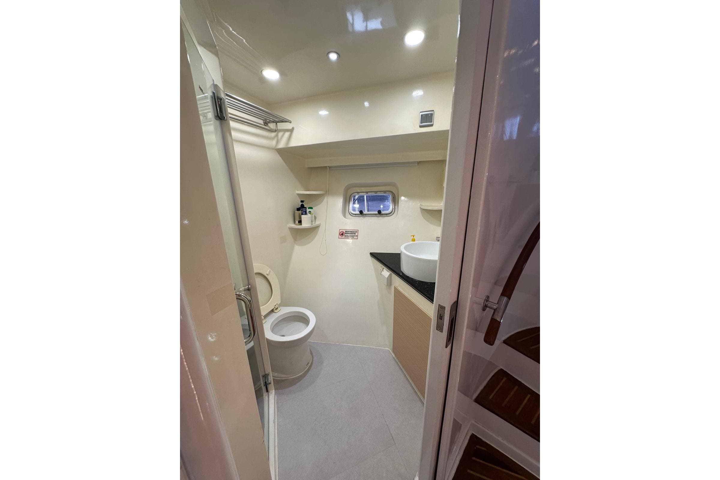 Luxurious bathroom interior of 2009 Paceboat 60 yacht, featuring modern fixtures and lighting.