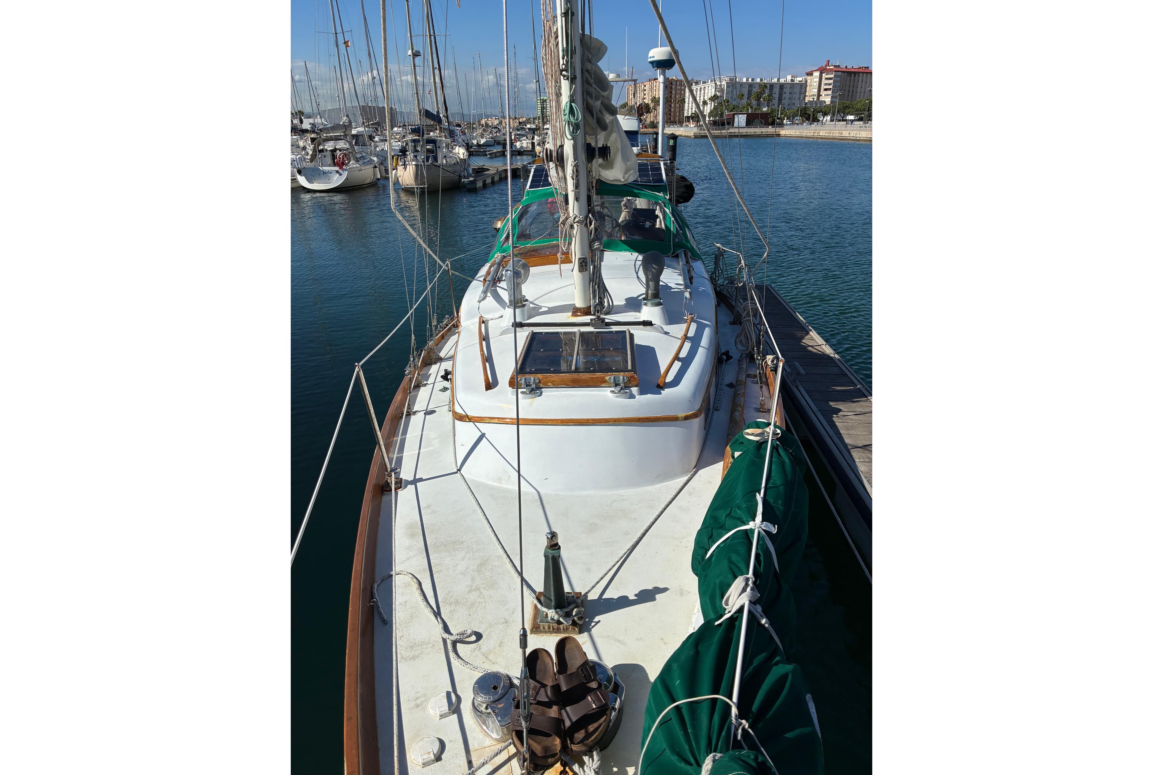 1974 Cheoy Lee Luders Offshore 28 sailboat docked at marina, sunny day.