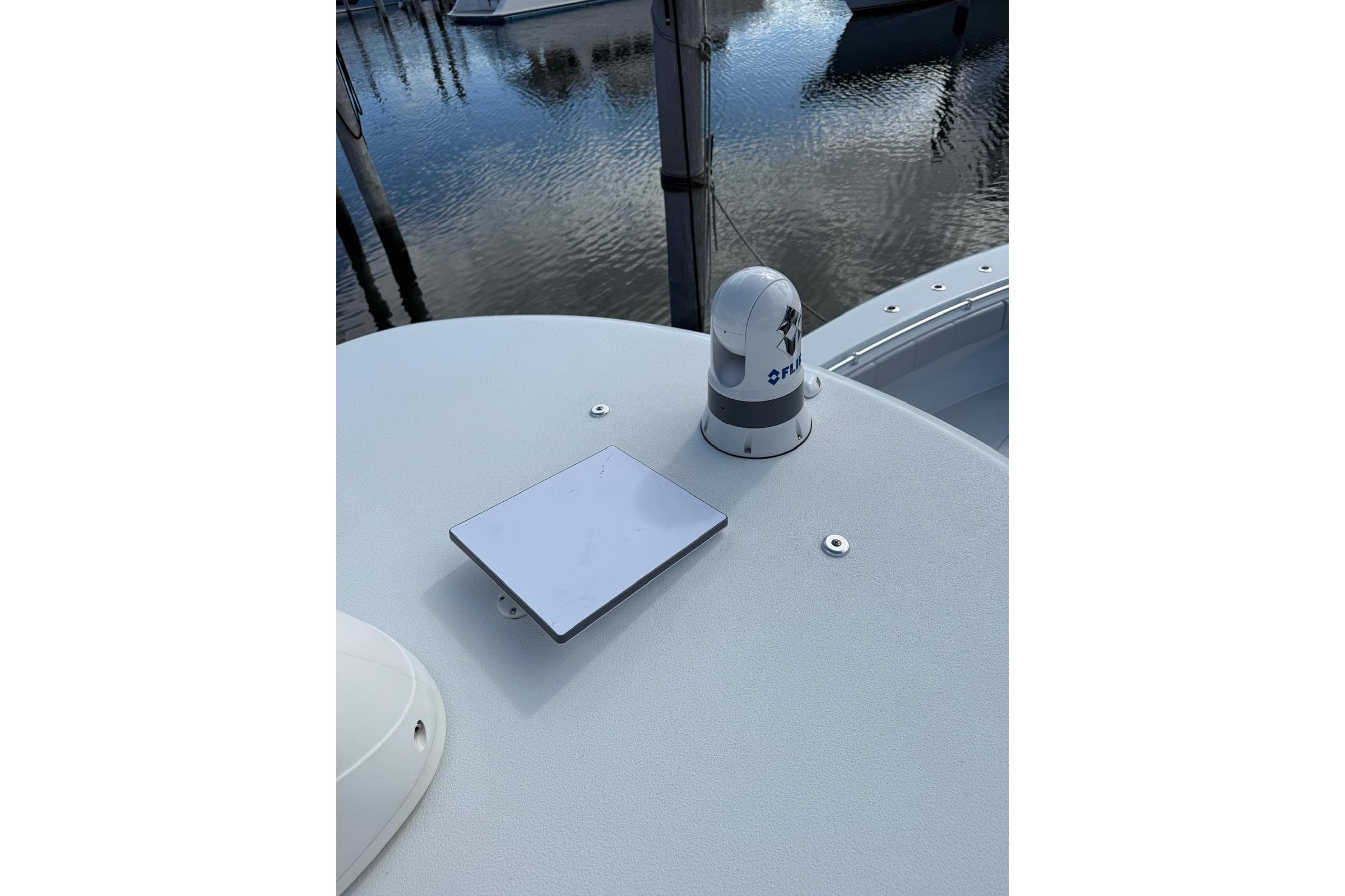 2024 Contender 39 ST boat deck with FLIR camera and reflective panel.