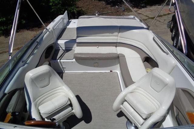 Interior of a 2001 Cobalt 246 boat with white seating and carpeted floor.