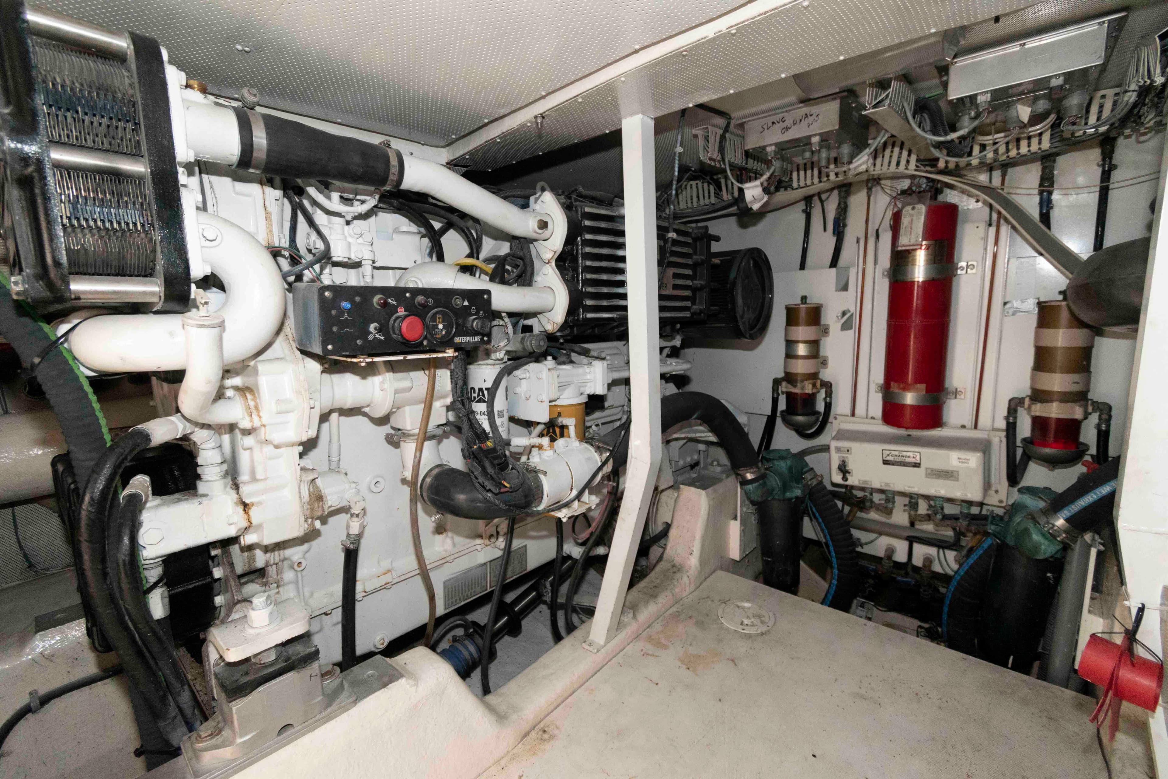 Engine room of 2003 Neptunus 56 Flybridge yacht, showcasing mechanical components and systems.