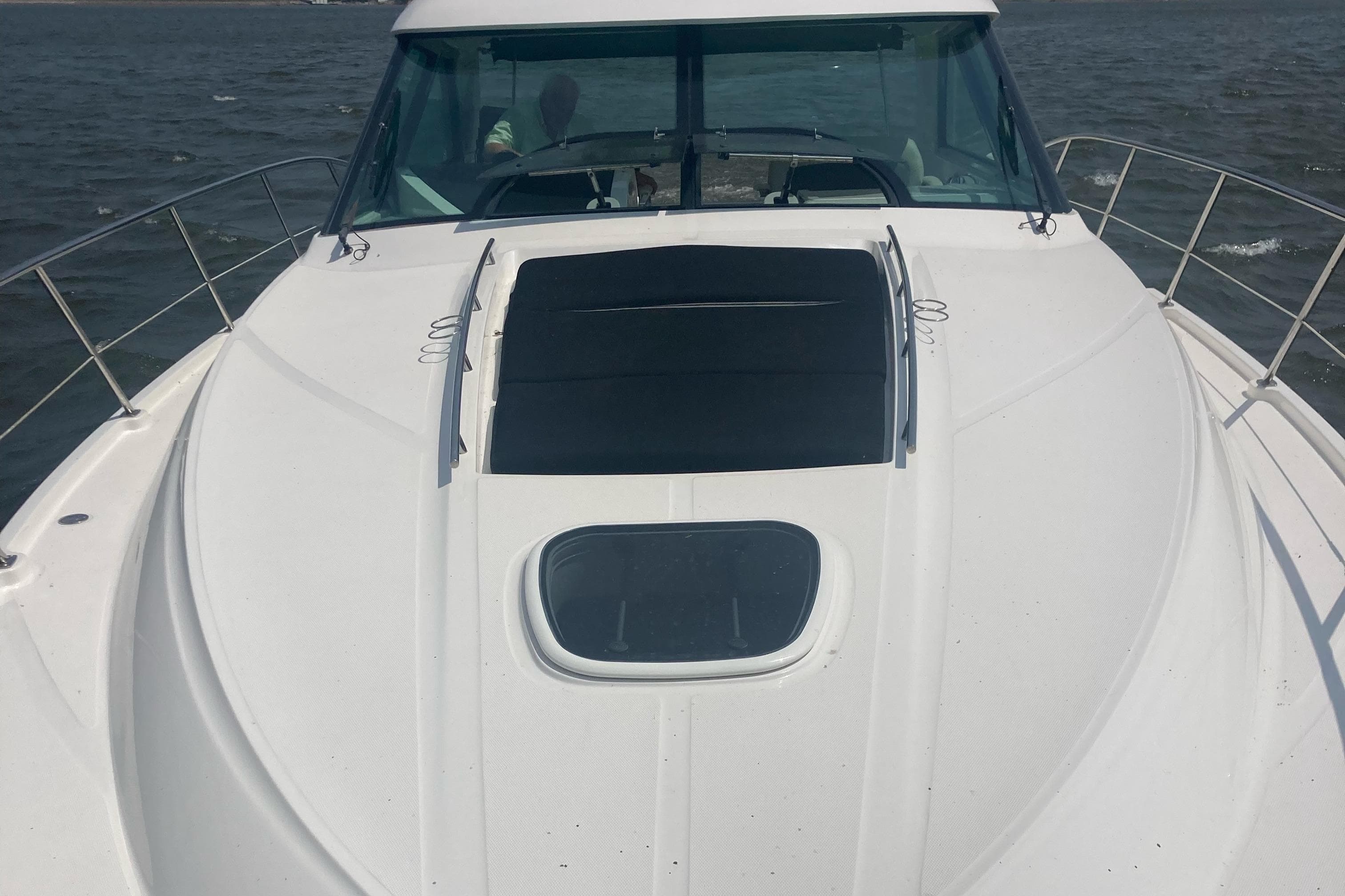 2015 Sea Ray 450 Sundancer yacht on open water, showcasing sleek deck design.