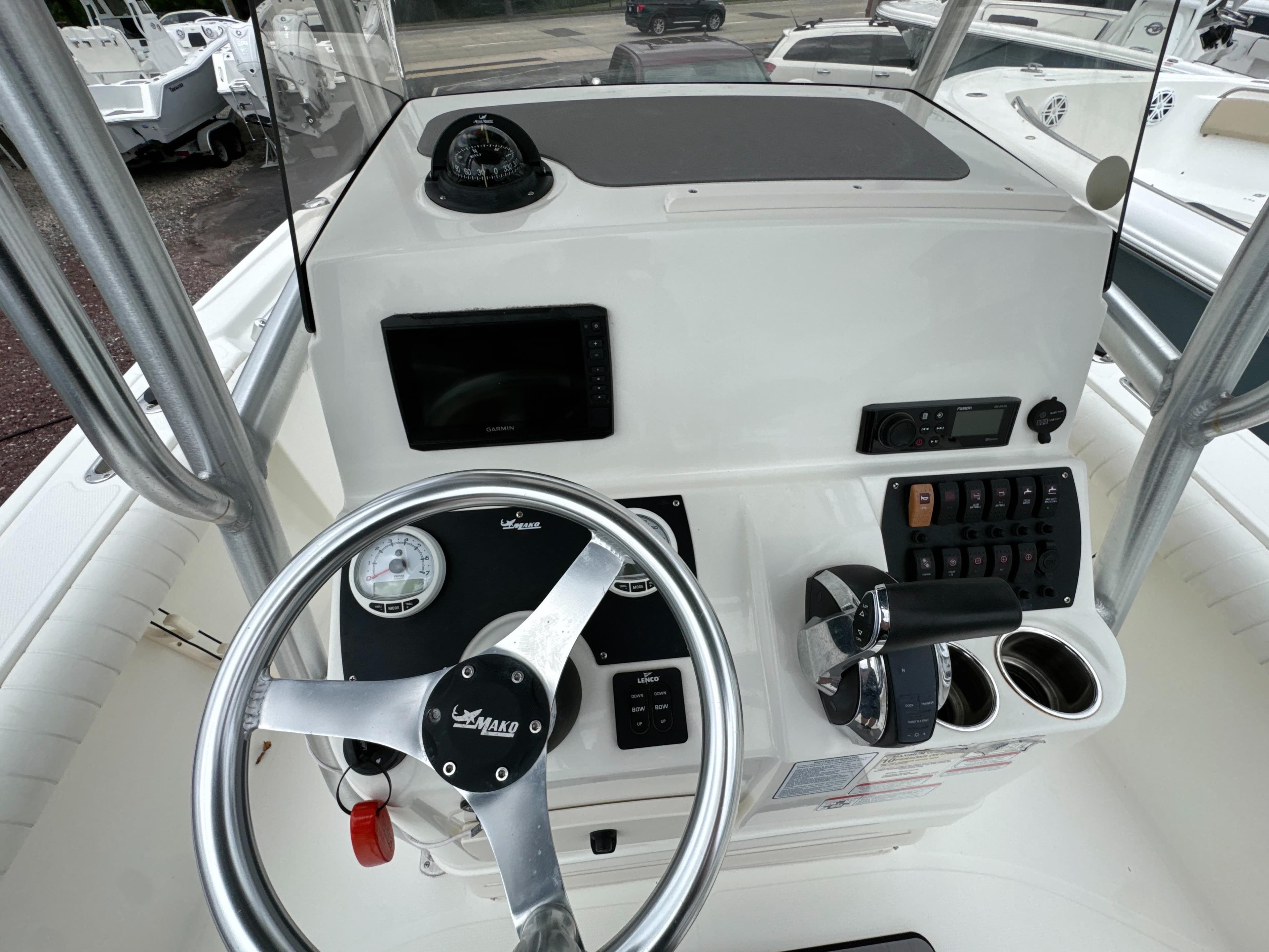 2017 Mako 214 CC boat console with steering wheel, gauges, and controls.