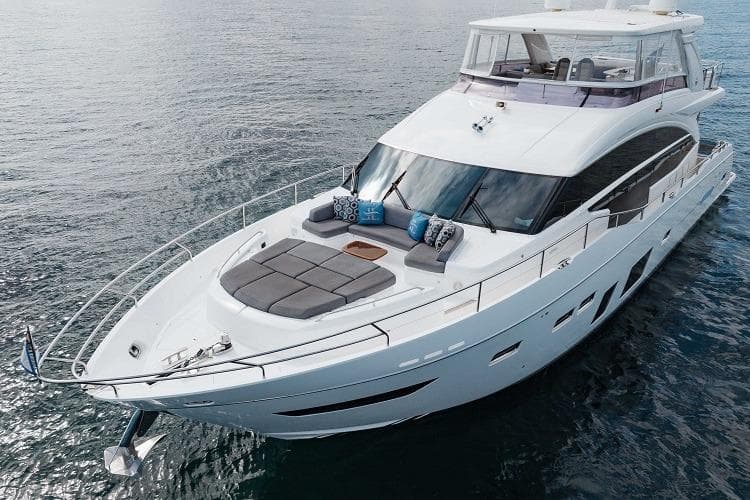 2017 Princess 75 Motor Yacht cruising on calm waters, featuring luxurious deck seating.