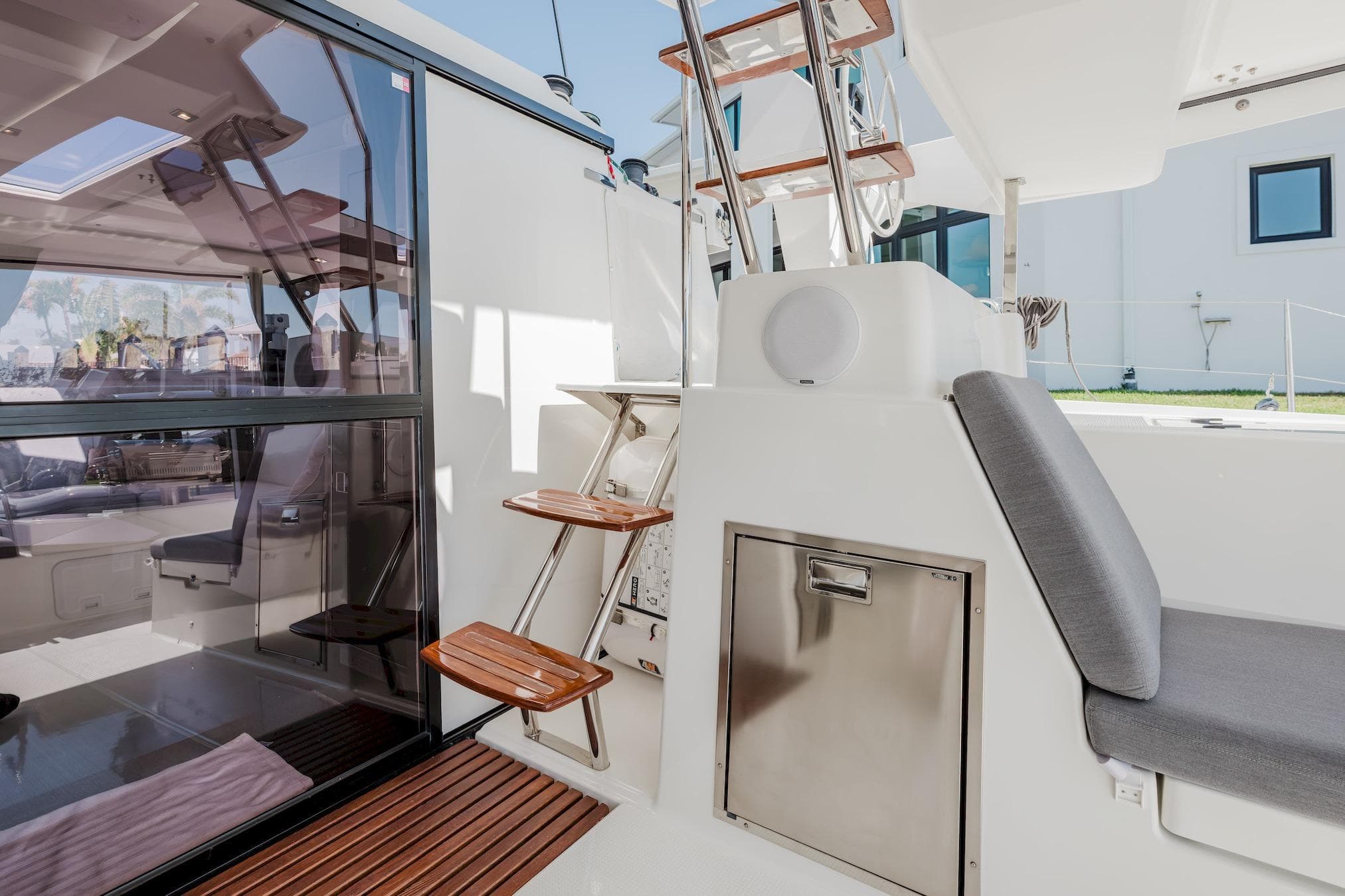 2020 Fountaine Pajot Saona 47 yacht interior with modern seating and wooden steps.