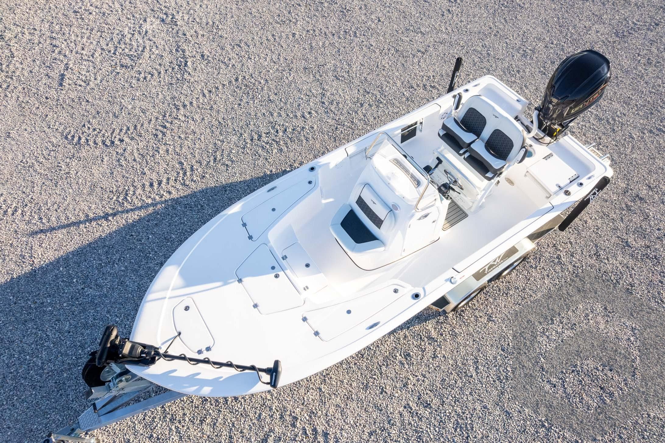 2026 Tidewater 2110 Bay Max boat on gravel, aerial view.