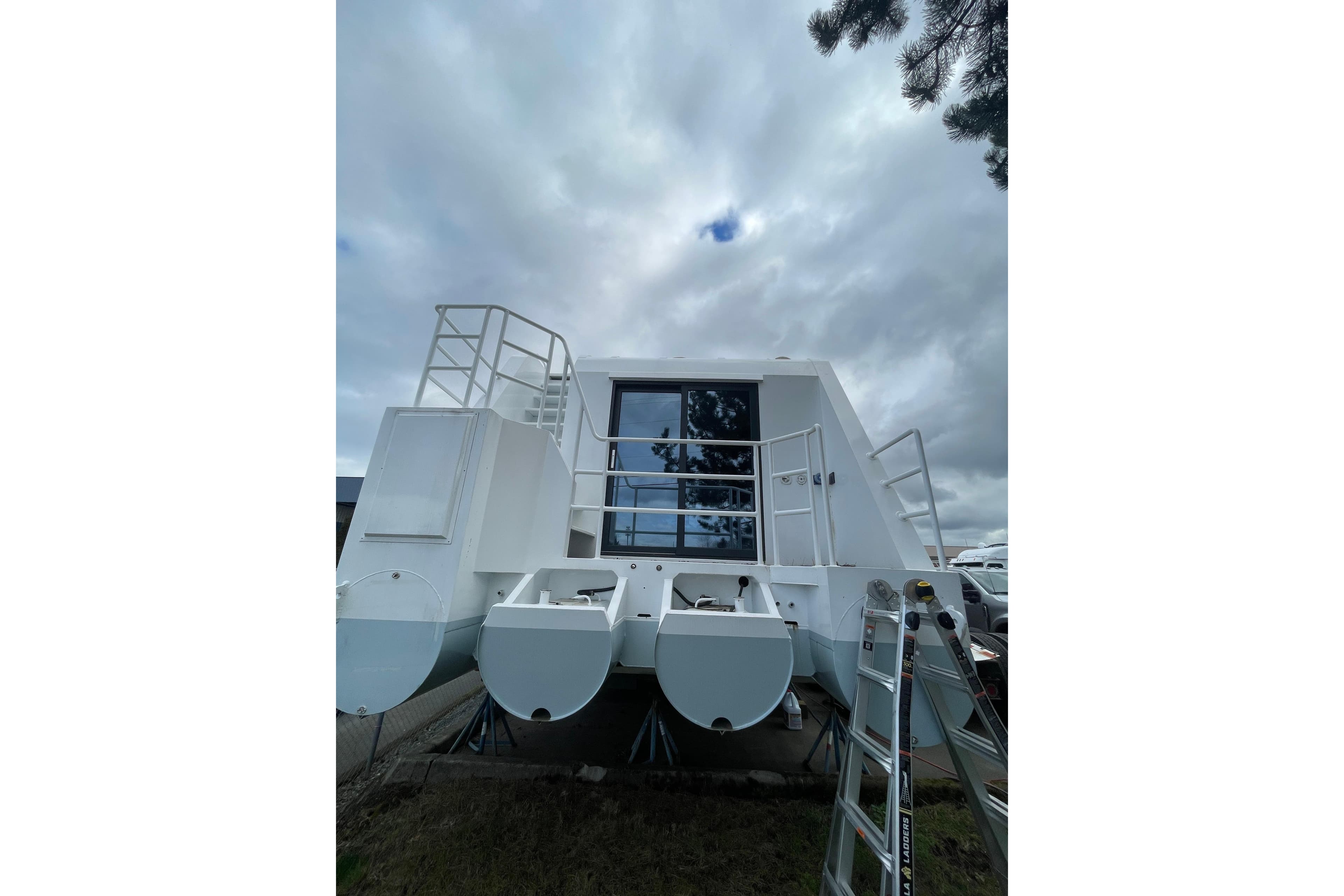 Modern 2025 ALLHOUSE HB-1250 houseboat with sleek design and spacious deck.