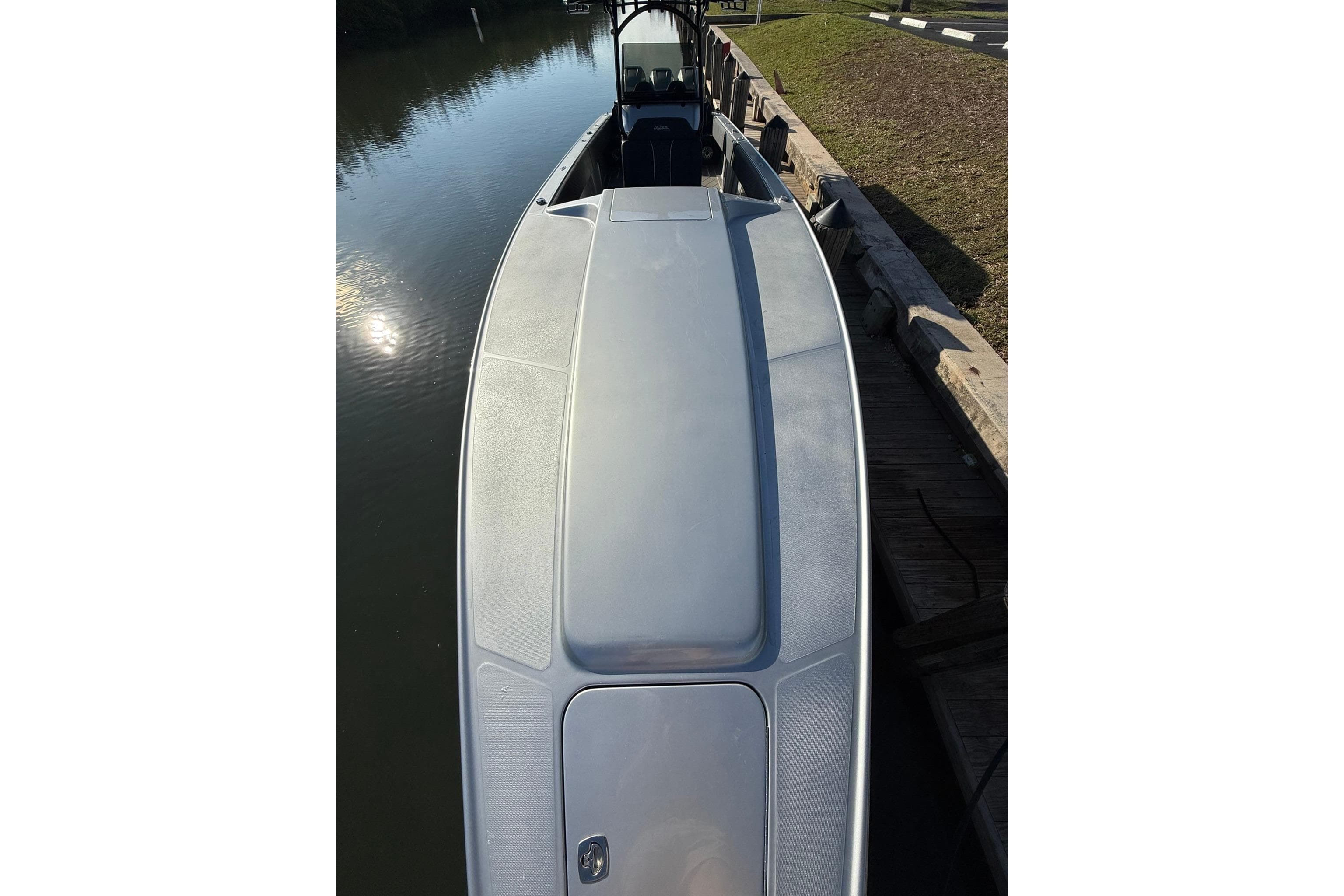 2006 Lazer 40 boat docked by calm water, top view.