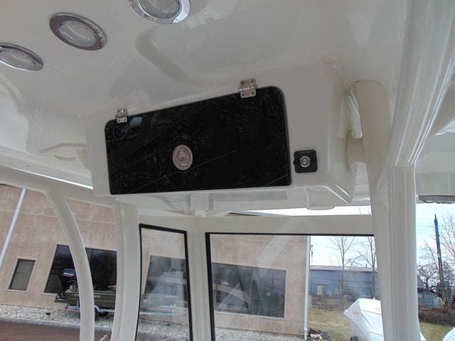 2025 Parker 2400 Center Console boat interior with overhead storage and lighting.
