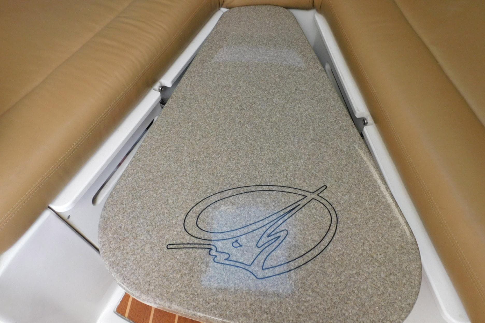 Interior view of a 2012 Sailfish 30-06 Express boat with cushioned seating.