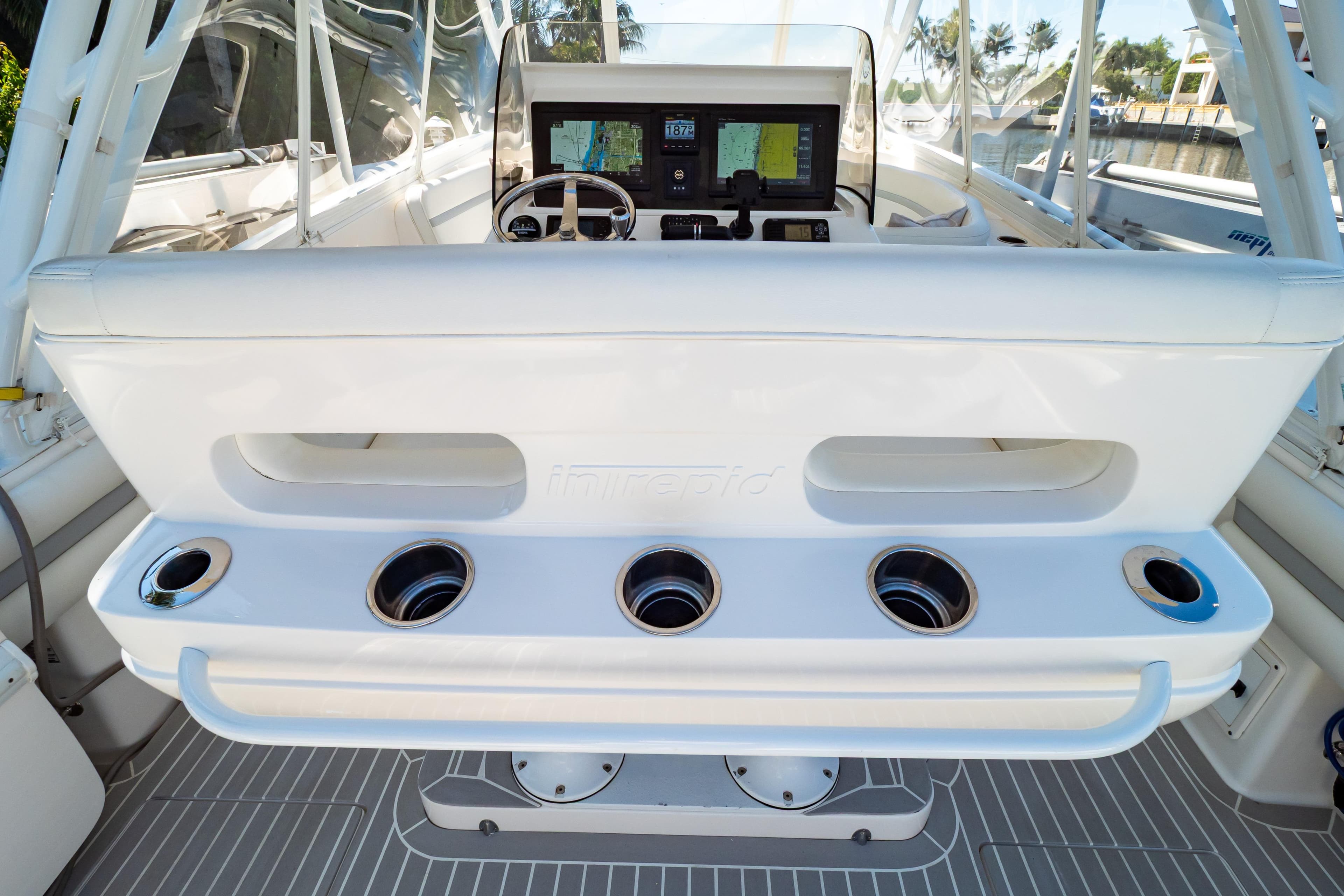 2016 Intrepid 400 Cuddy helm with modern controls and cup holders.