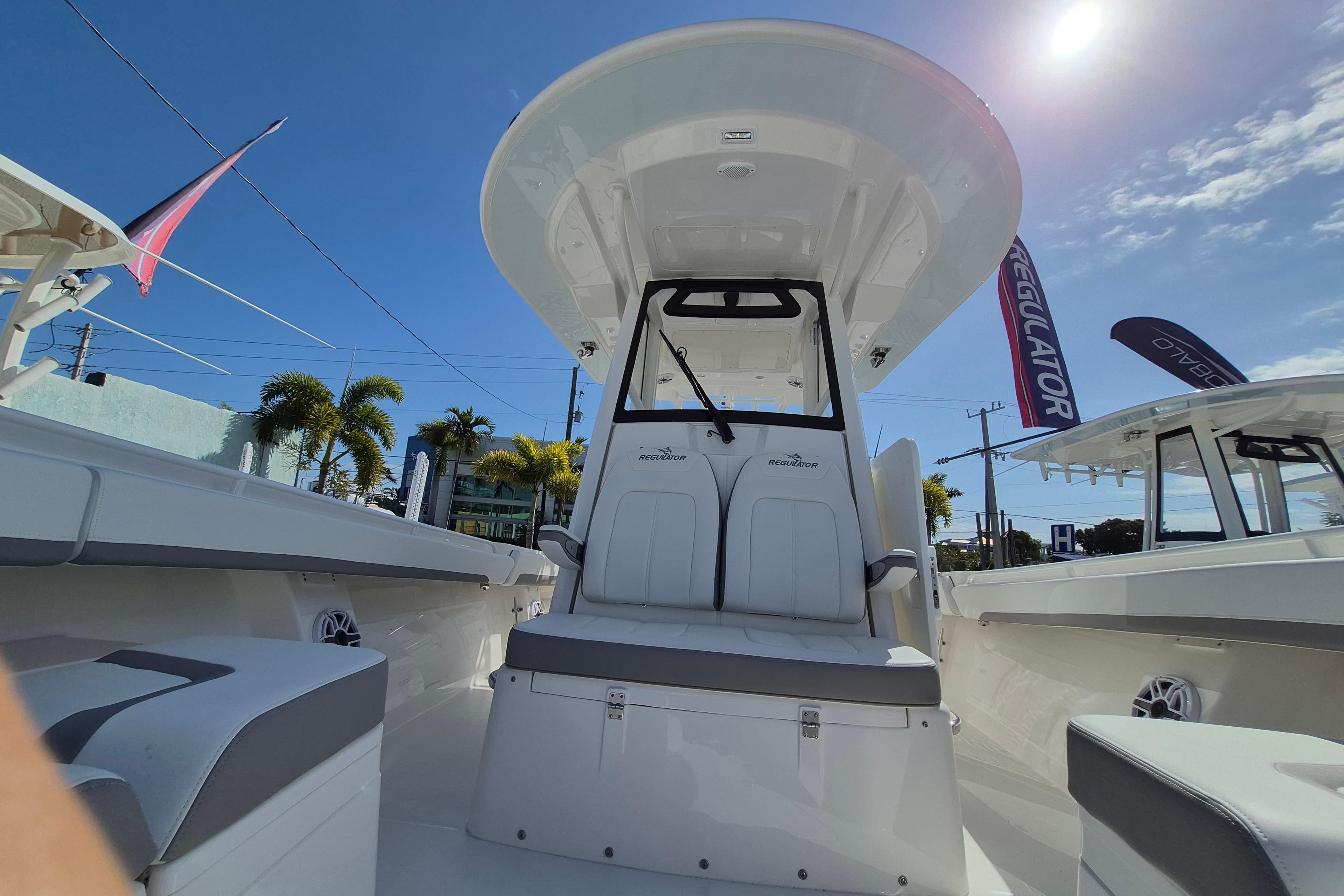 2026 Regulator 31 boat interior with seating, under a clear blue sky.