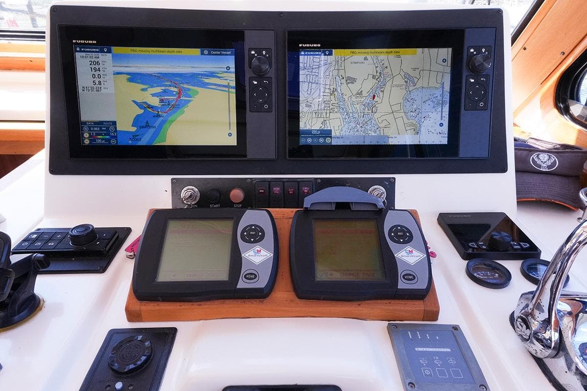 Control panel of a 2006 Sabre 38 Hard Top Express with navigation screens.