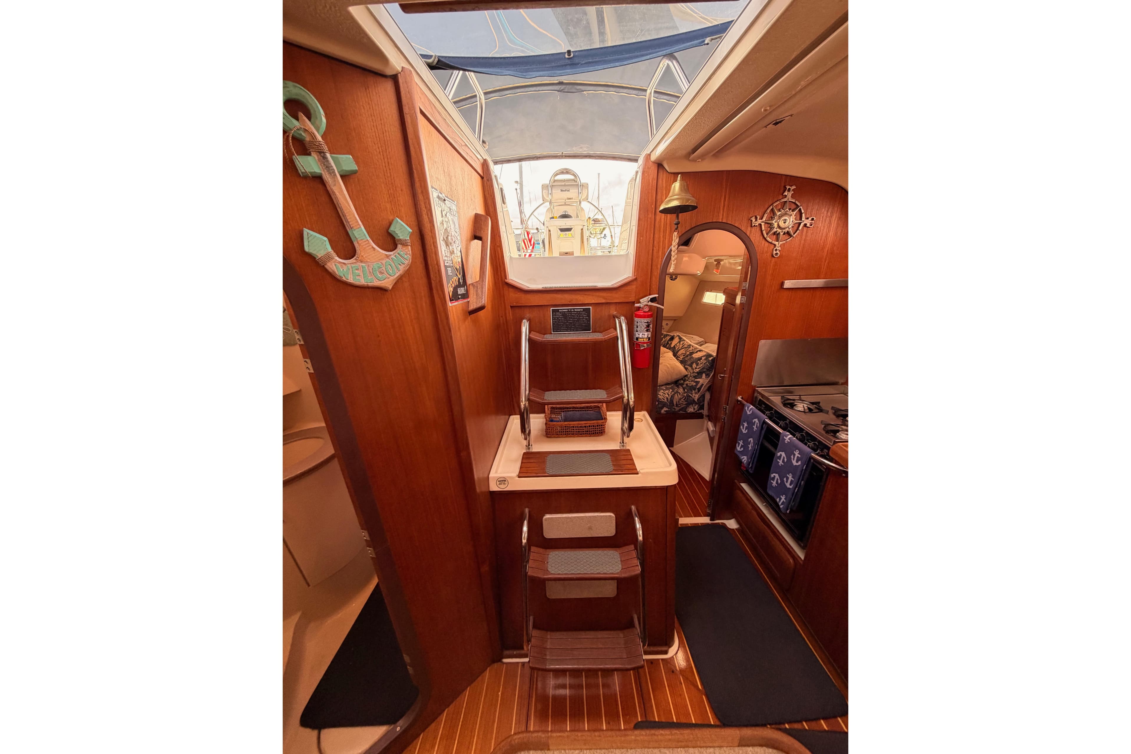 Interior of 1998 Hunter Legend 40.5 sailboat with wooden decor and nautical accents.
