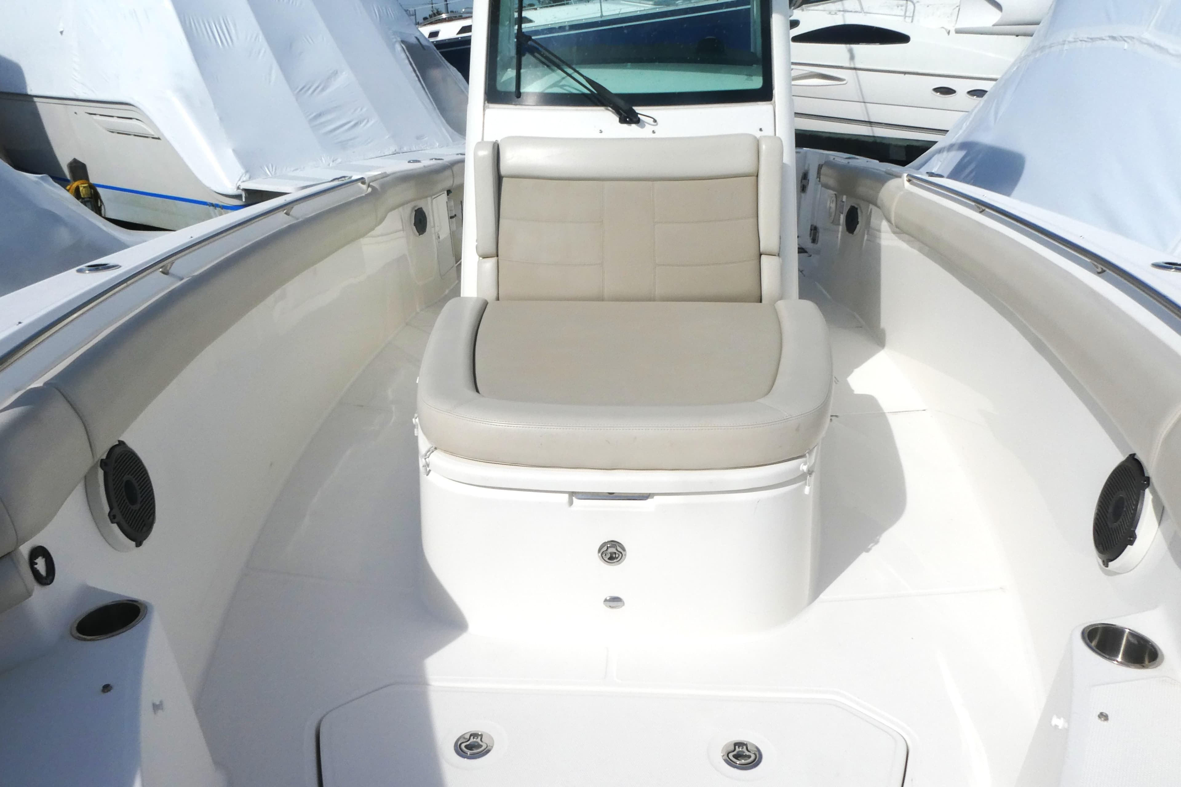 2020 Boston Whaler 330 Outrage boat interior with cushioned seating and sleek design.