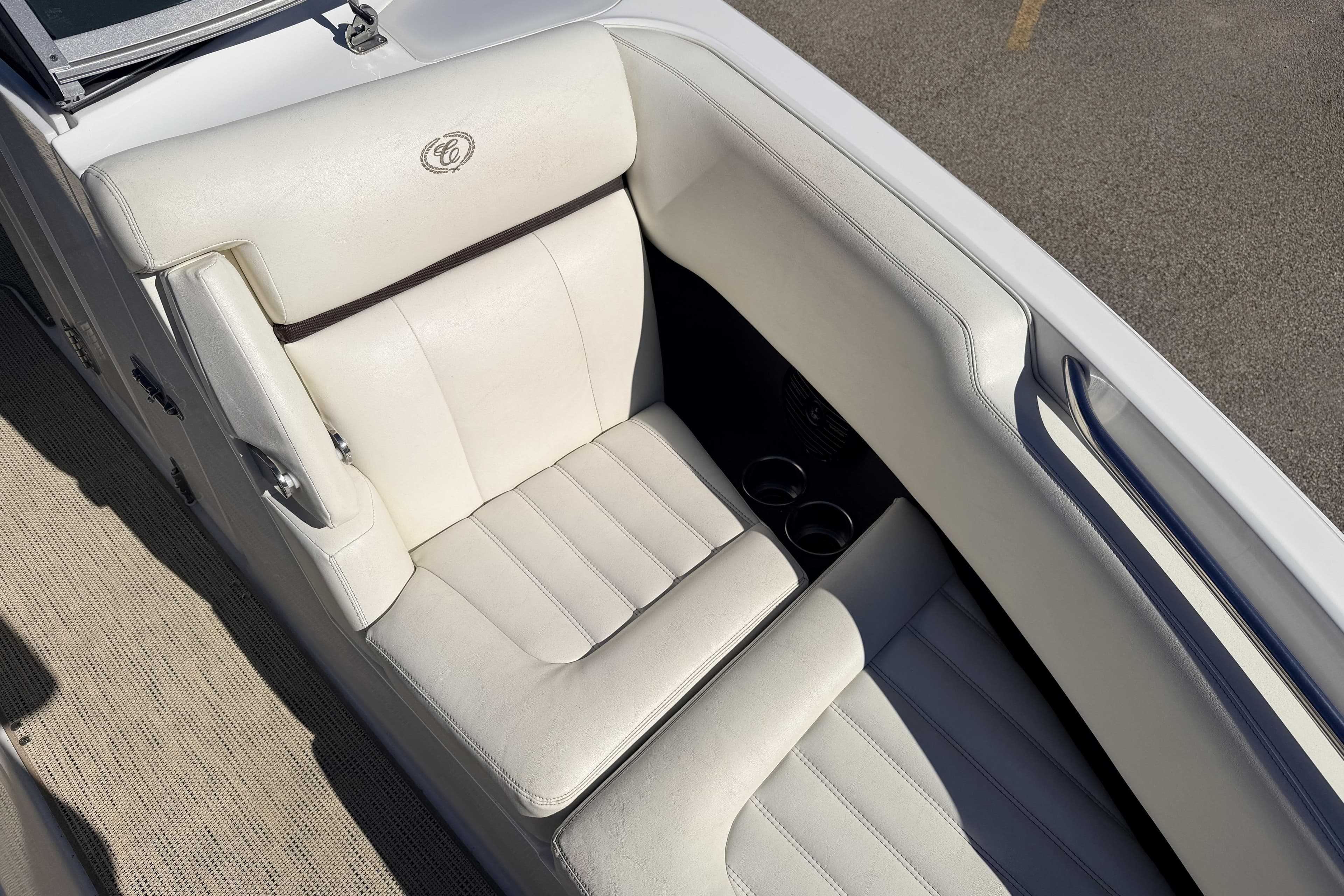 2016 Cobalt R7 boat interior with white leather seating and cup holders.