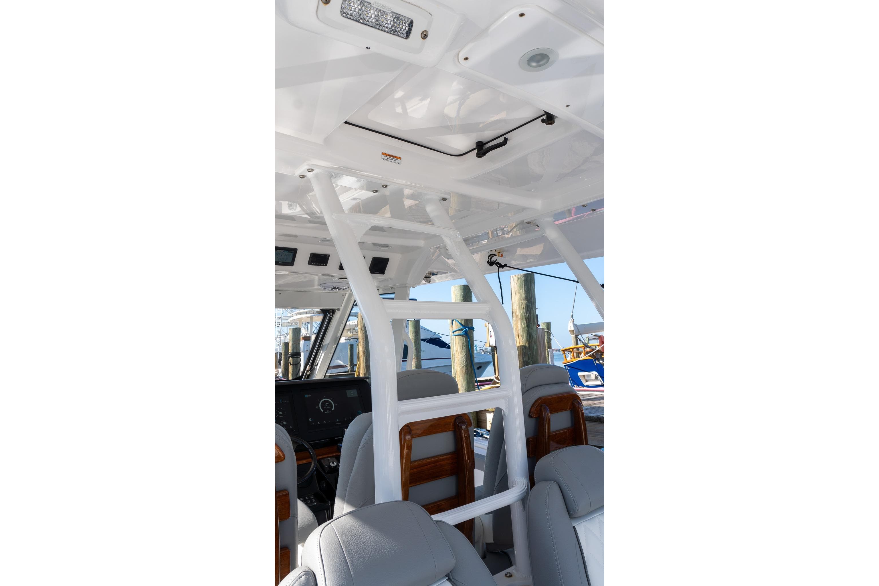 2024 Everglades 395 Center Console interior with seating and helm station.