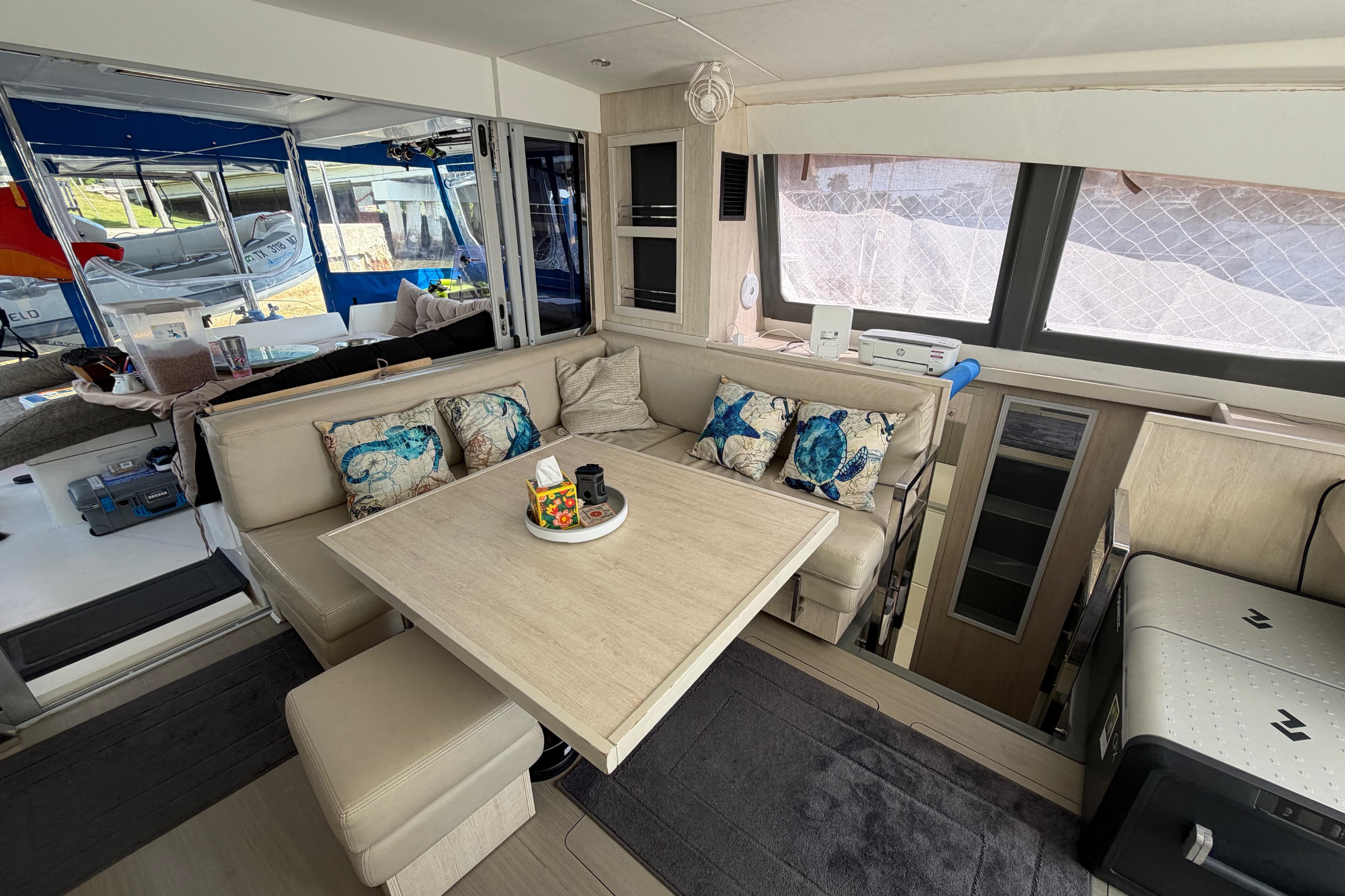 Luxurious interior of a 2017 Leopard 40 catamaran with cozy seating and nautical decor.