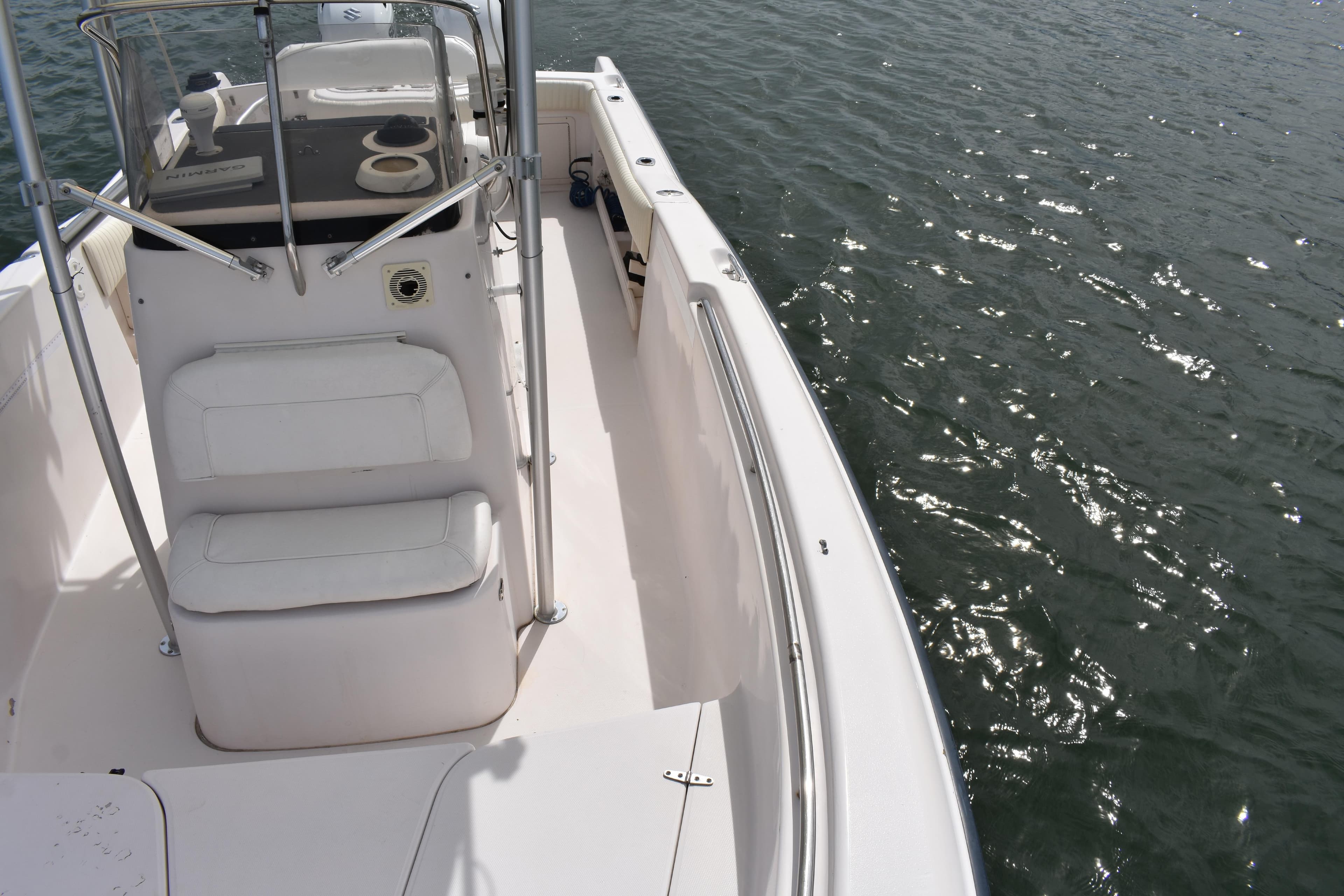2001 Grady-White Advance 247 boat on water, featuring white seating and console.