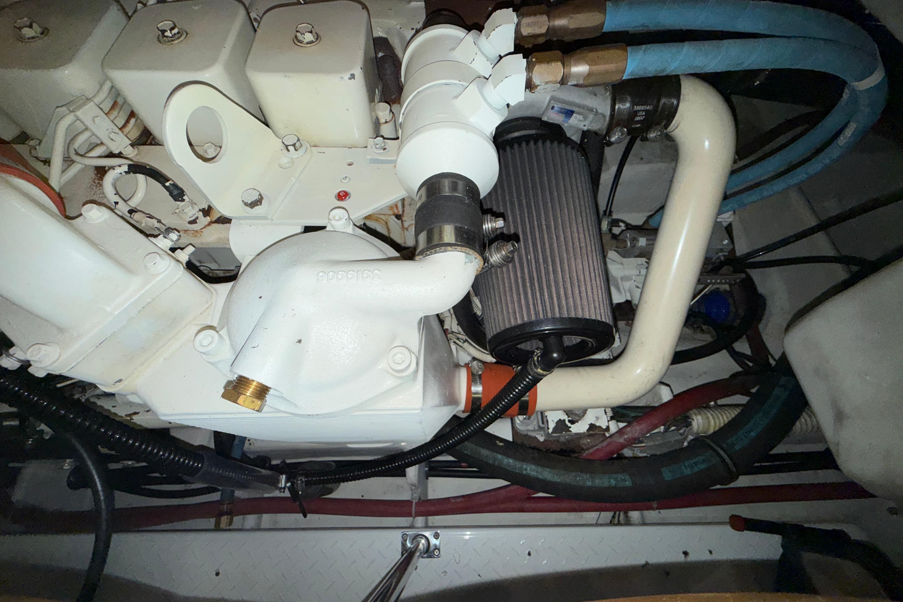 Engine compartment of a 1998 Bayliner 4788 Pilot House Motoryacht, showing mechanical components.
