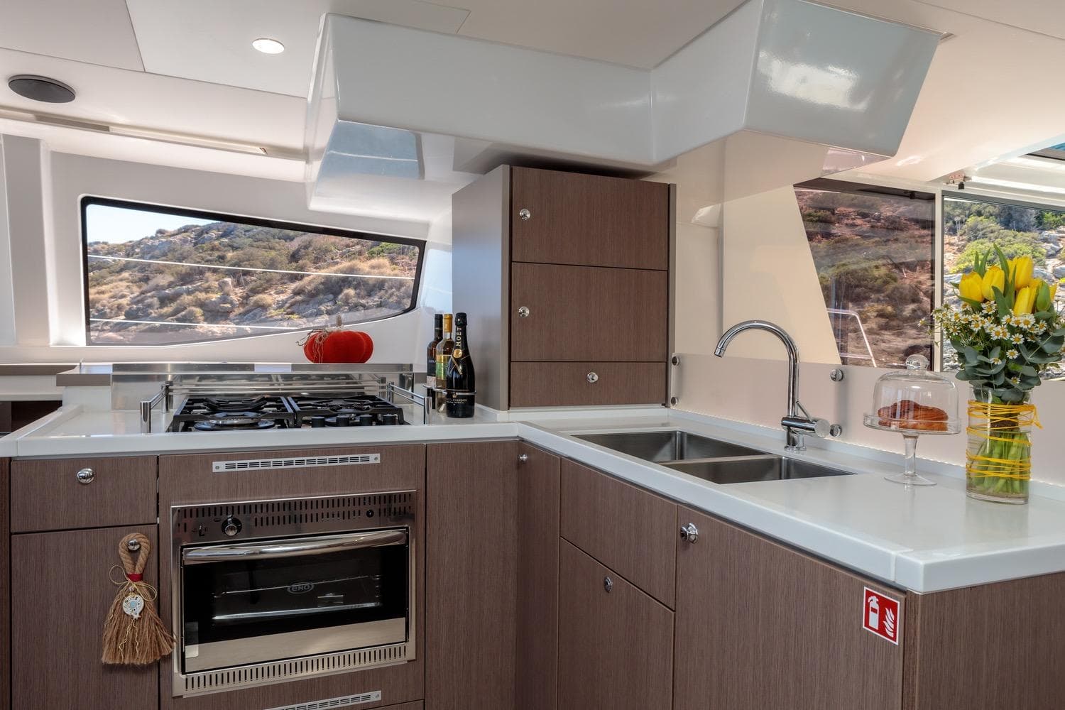 Modern kitchen interior on a 2020 Bali 4.8 yacht with scenic window view.