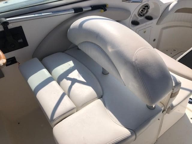 2008 Glastron GS 259 boat interior with white leather seating.