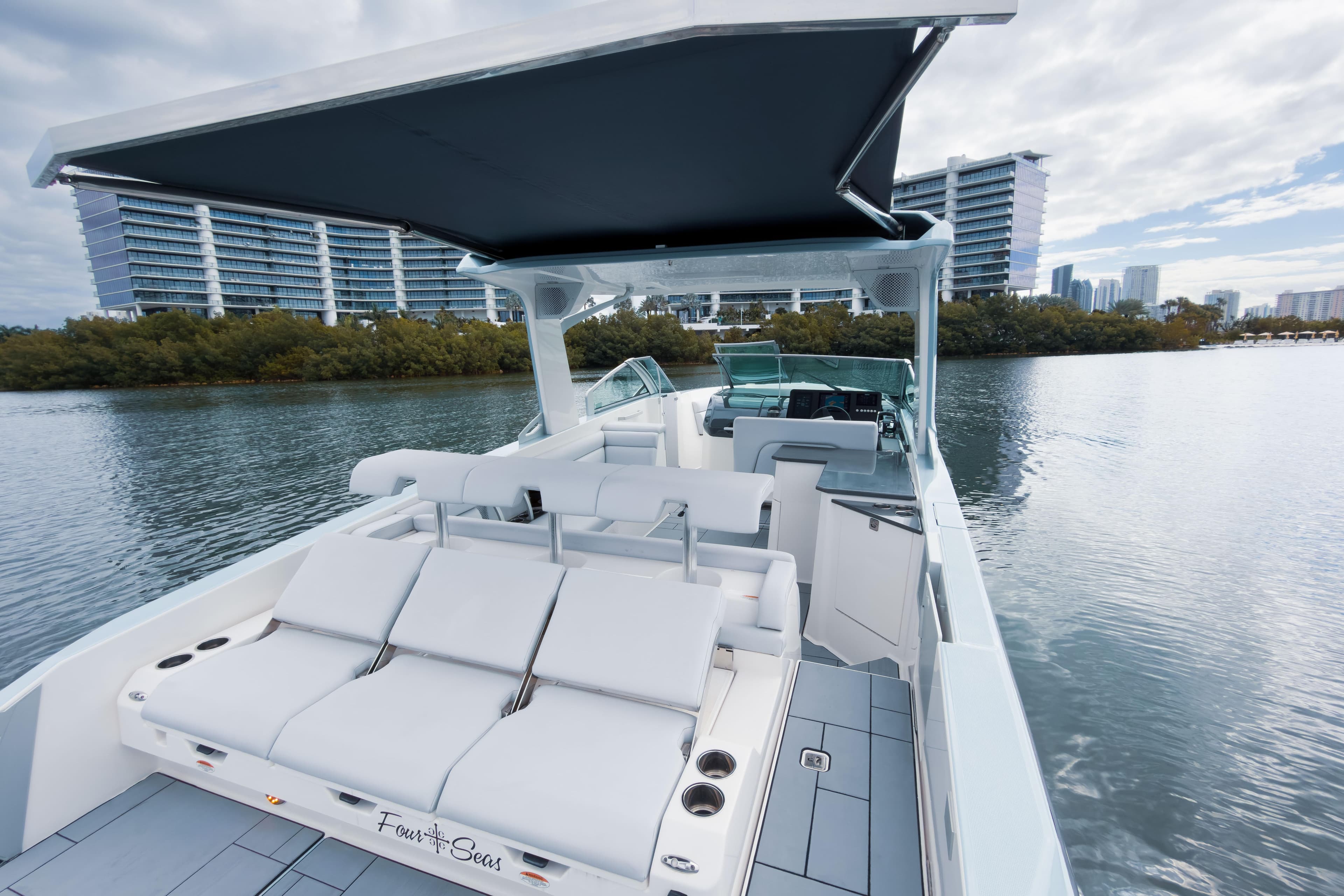 2022 Aviara AV32 OB luxury boat with sleek design on calm water.