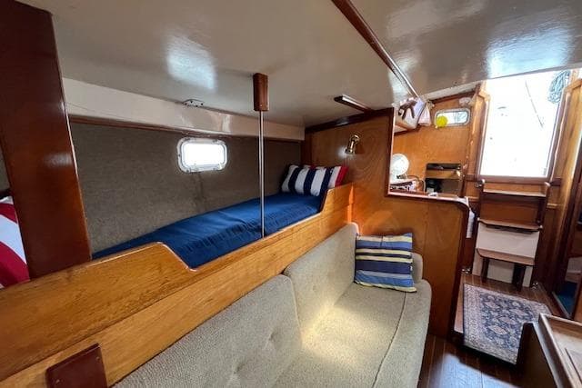 1982 Chaser 39 yacht interior with cozy wooden cabin and comfortable seating.
