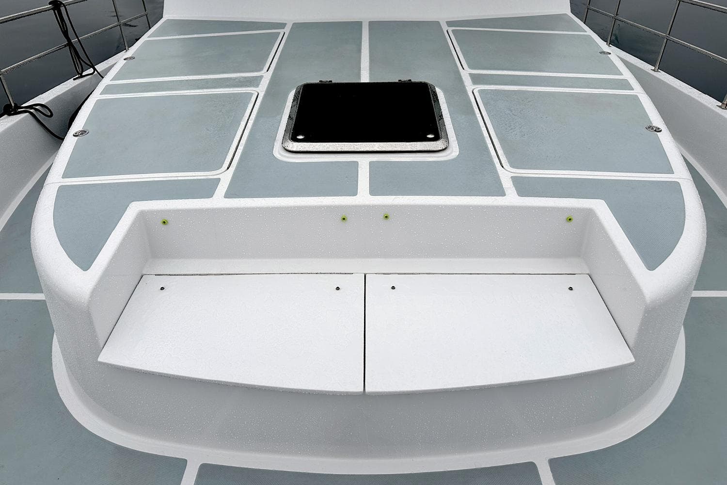 2026 Helmsman Trawlers 46 Pilot House deck with storage compartments and hatch.