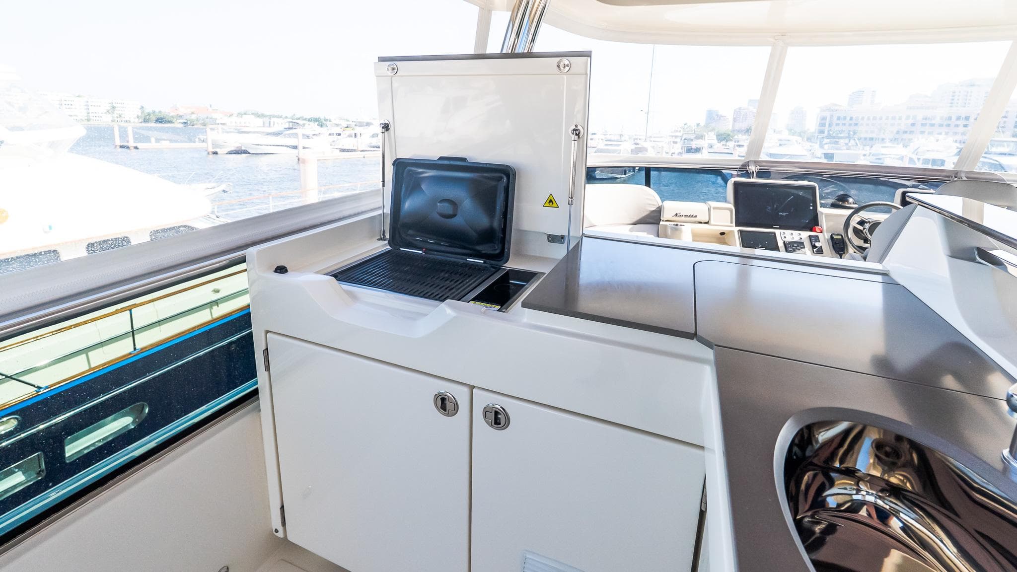 2024 Absolute 68 NAVETTA yacht interior with modern navigation equipment and sleek design.