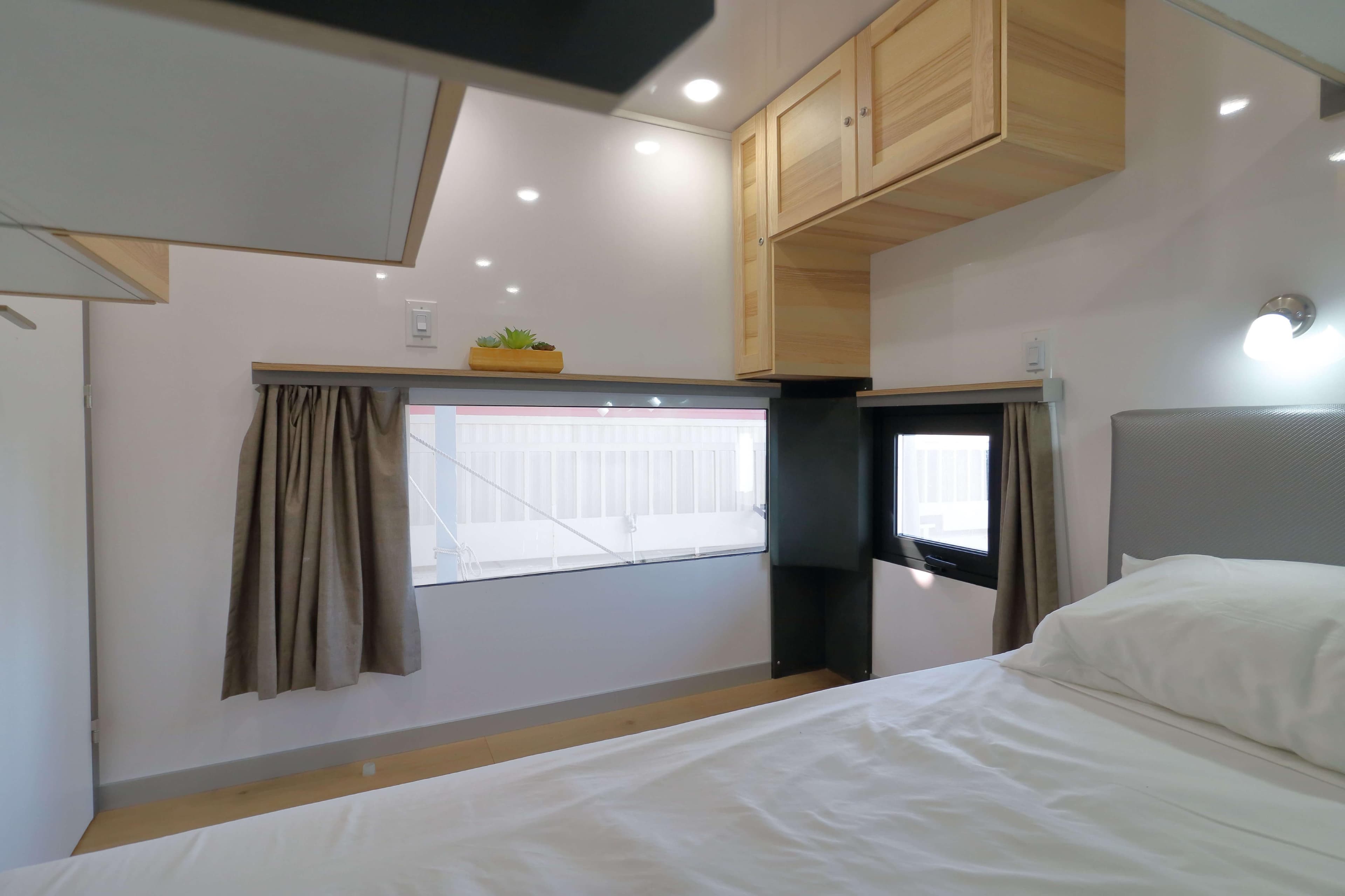 Modern bedroom interior in Navisyo Homes NV.08, 2021 model, featuring sleek design and natural light.