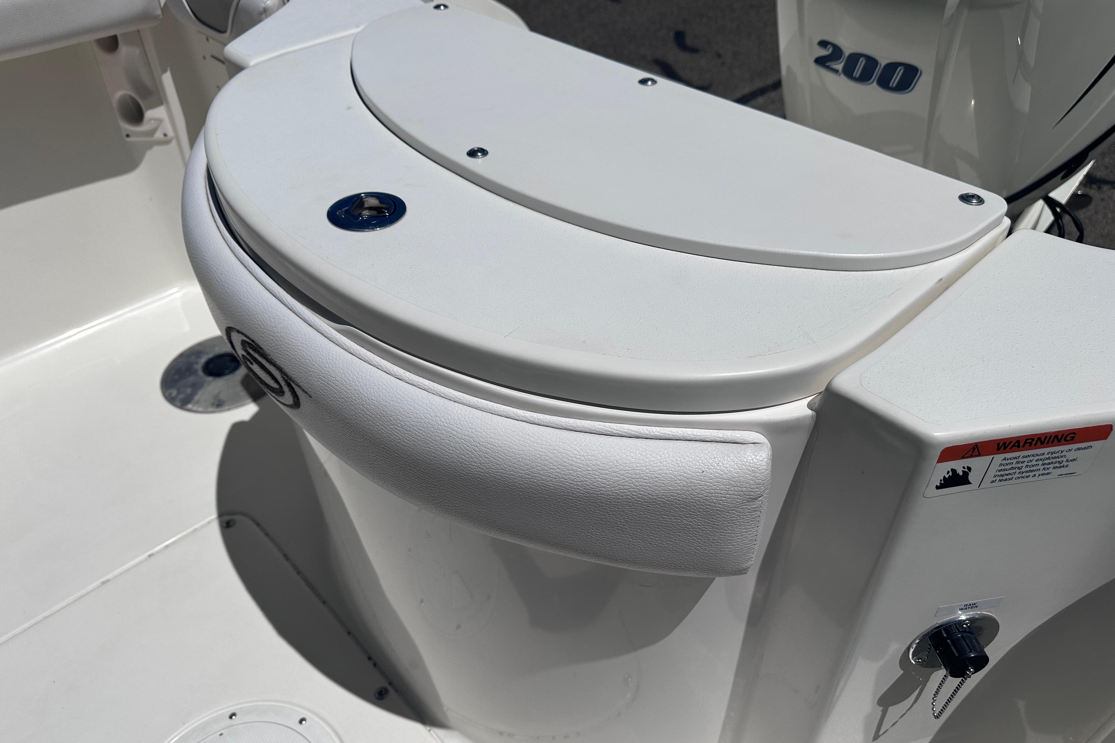 2011 Seaswirl Striper boat interior detail with seating and engine view.