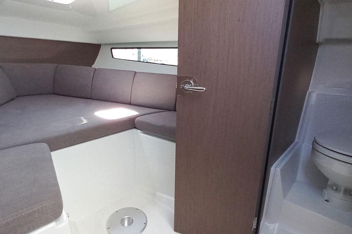 Interior of 2026 Beneteau Flyer 8 SUNdeck with seating and toilet.