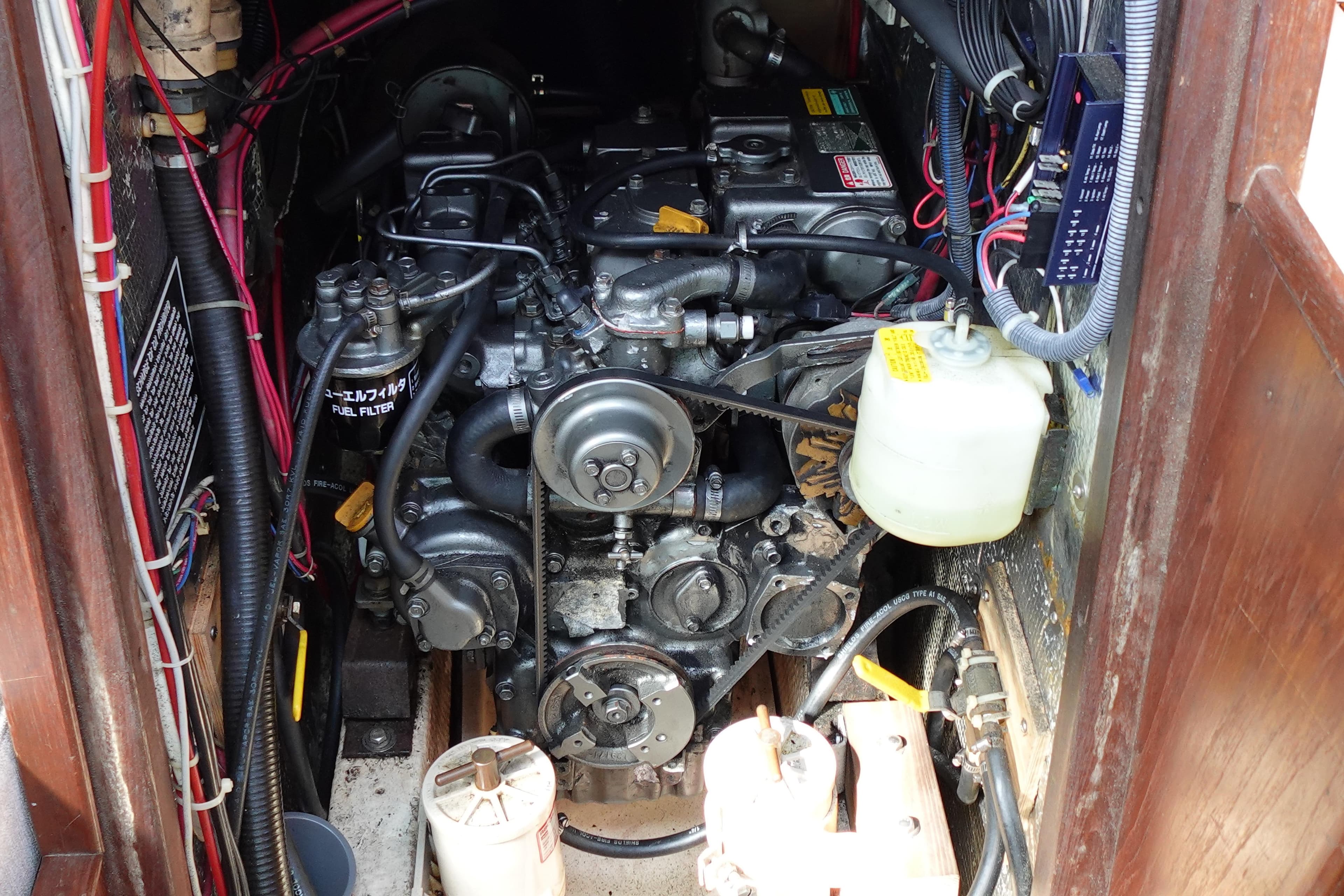 Engine compartment of a 1978 Morgan 382 sailboat, showcasing detailed mechanical components.